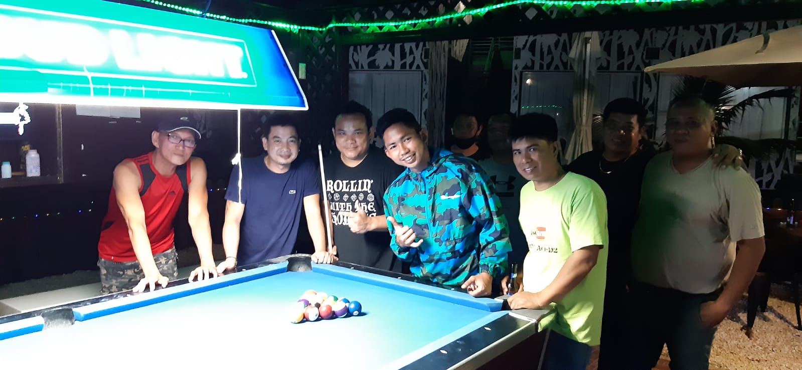 The Bamboo NSA Kabalen and the VFW Crazy Shooters pose for a photo after their match on Tuesday, May 17, at the New Bamboo Bar of Saipan Vegas.
