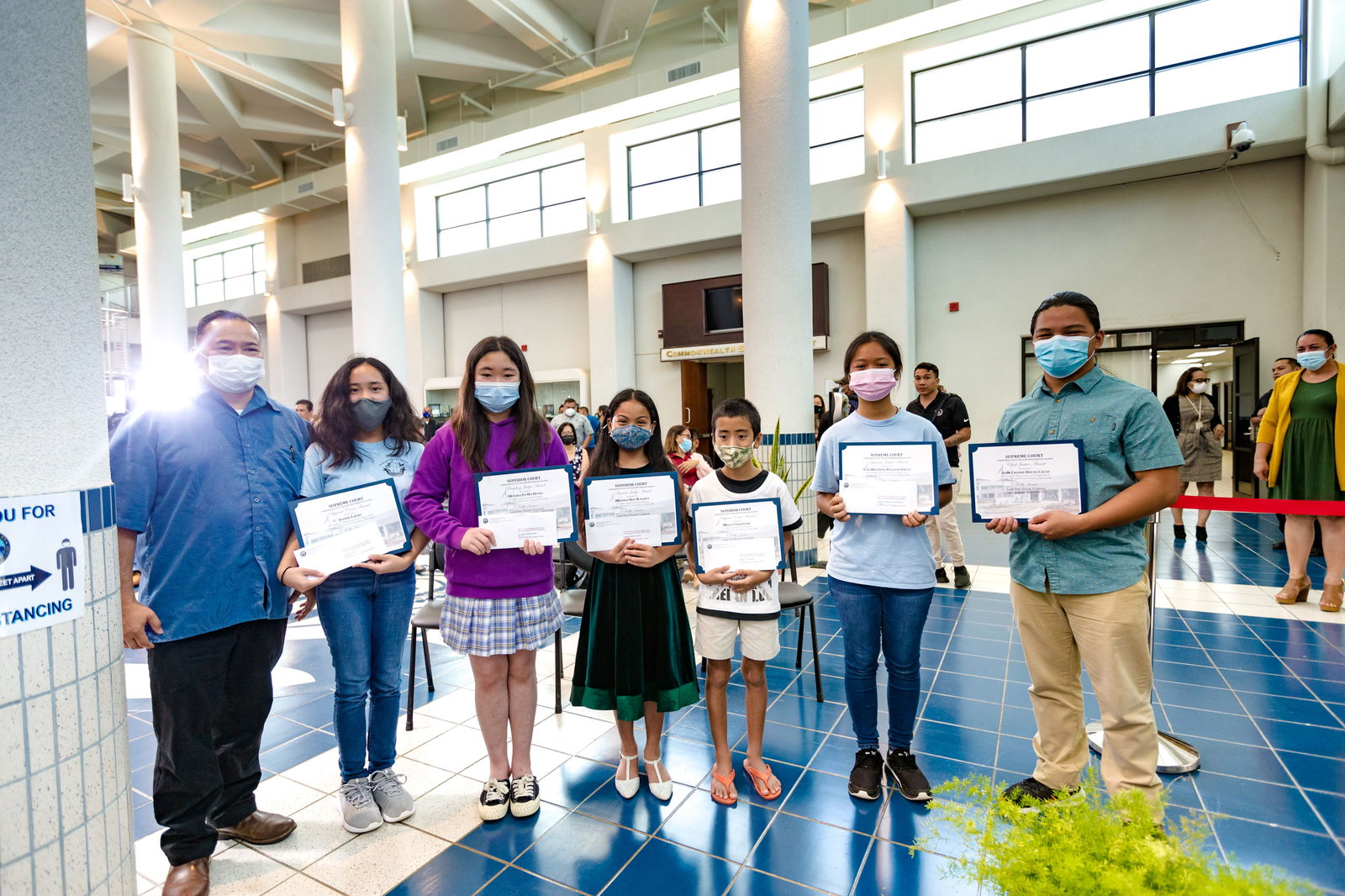 Law Day essay and poster contest winners pose for a photo with Education Commissioner Dr. Alfred A. Ada, left.Middle school essay-writing winners• First place: Aden Chonne Hocog Calvo,  Chief Justice Award• Second place: Lovelee Zhene Baladad Jingco, Associate Justice Award• Third place: Elanne Ladao, Supreme Court AwardAll three are eighth graders at Dr. Rita H. Inos Jr.-Sr. High School on Rota. Elementary school poster contest winners• First place: Victoria En Mei Huang,  4th grade, Presiding Judge Award• Second place: Breanna May M. Lopez, 5th grade, Associate Judge Award• Third place: Minato Takahashi, 5th grade,  Superior Court AwardAll three are Grace Christian Academy students.