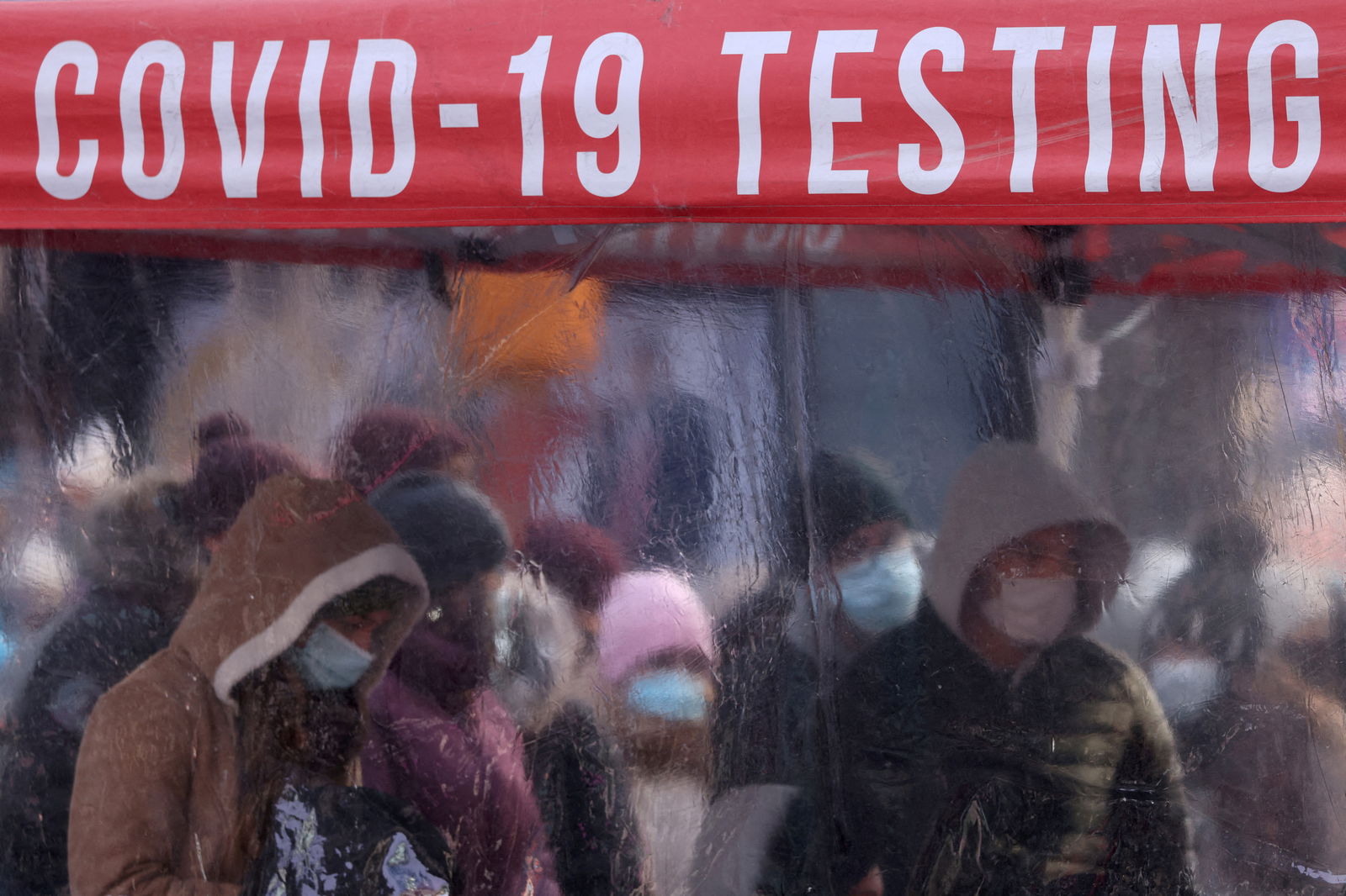 People queue to be tested for Covid-19 in Times Square, as the Omicron coronavirus variant continues to spread in Manhattan, New York City, Dec. 20, 2021.
