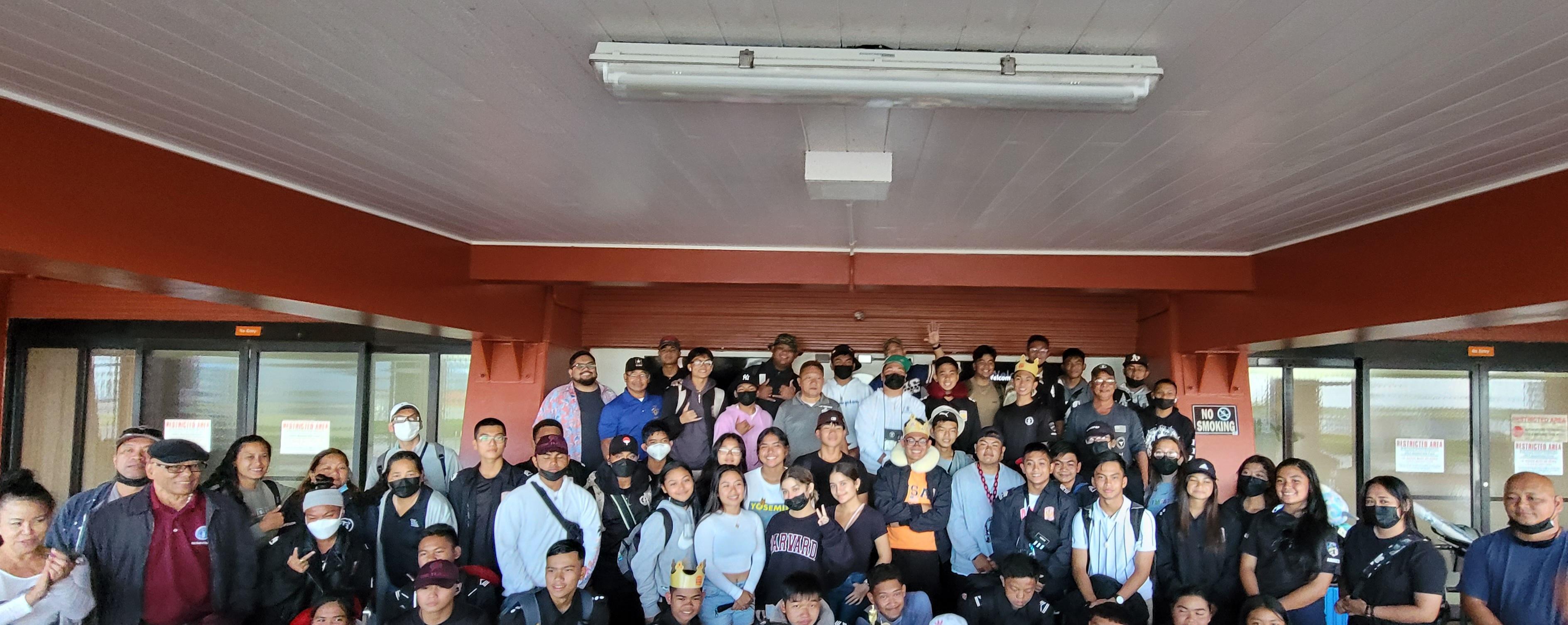 The CNMI JROTC cadets, along with their chaperones, pose for a group photo Wednesday at the Saipan airport upon their return from the national drill meet in California.