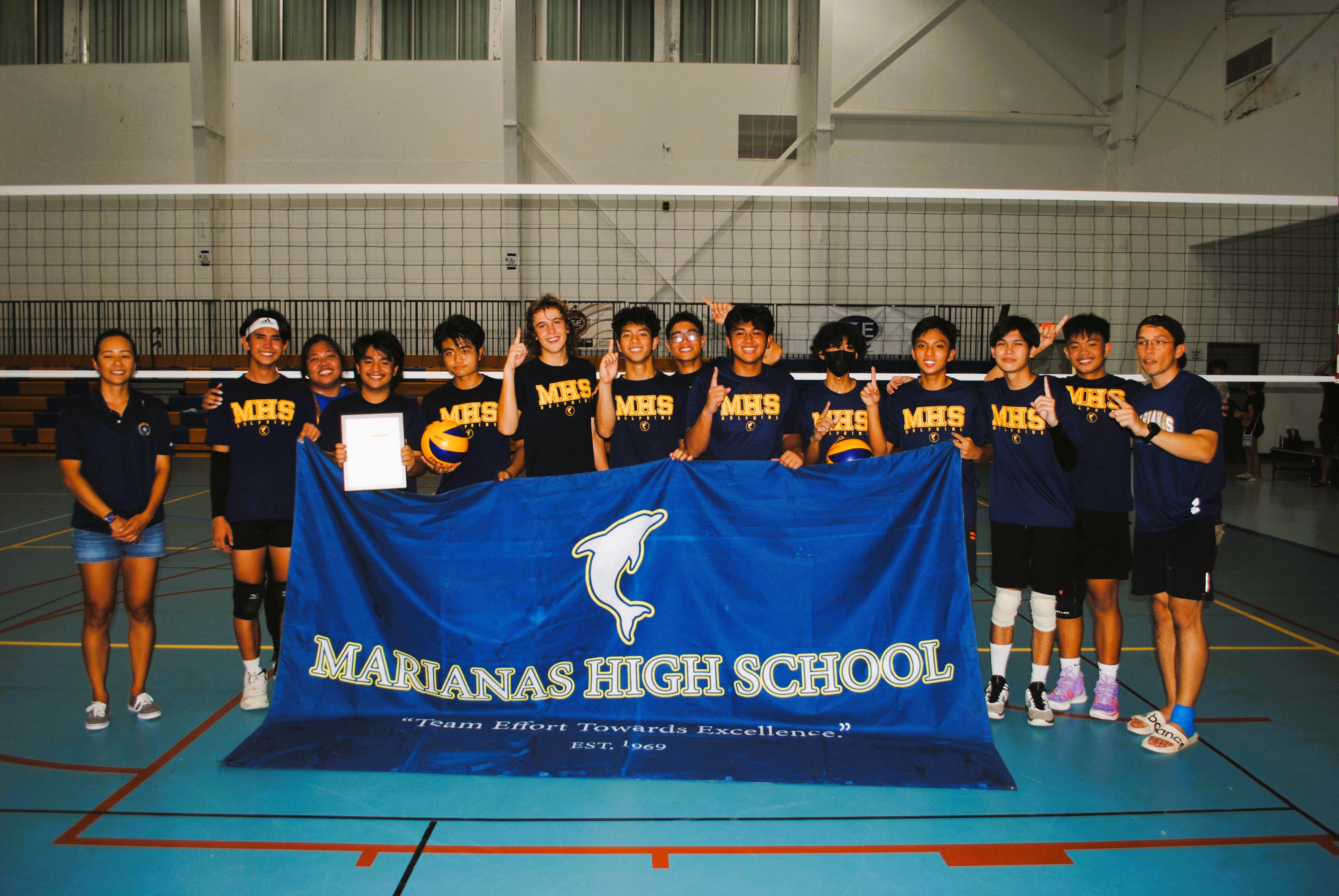 The MHS boys high school team members pose with the championship plaque.