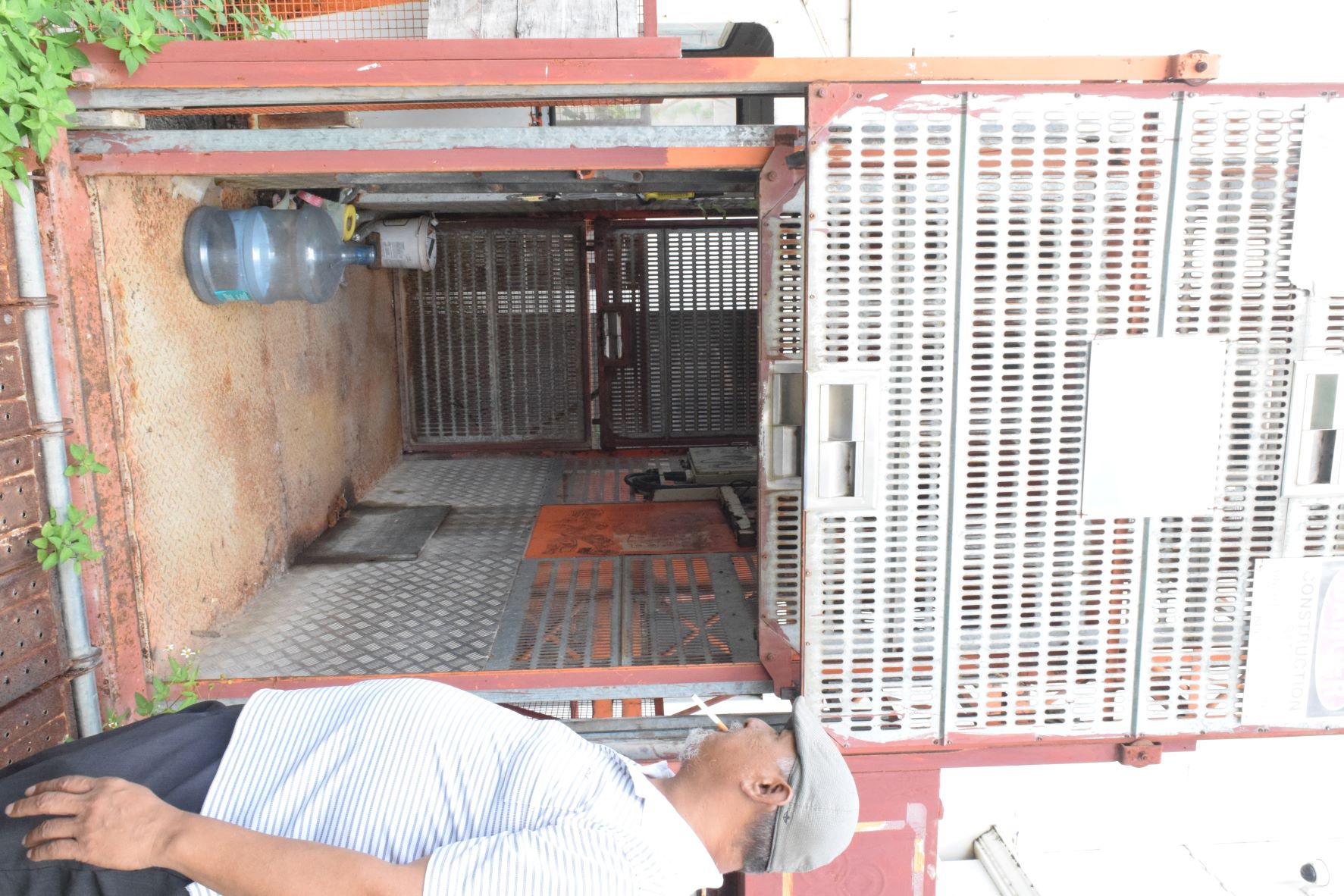 Former Imperial Pacific International construction team leader Alex Aquiningoc checks, for the last time, the elevator his team used in performing their job at the IPI construction site in Garapan.