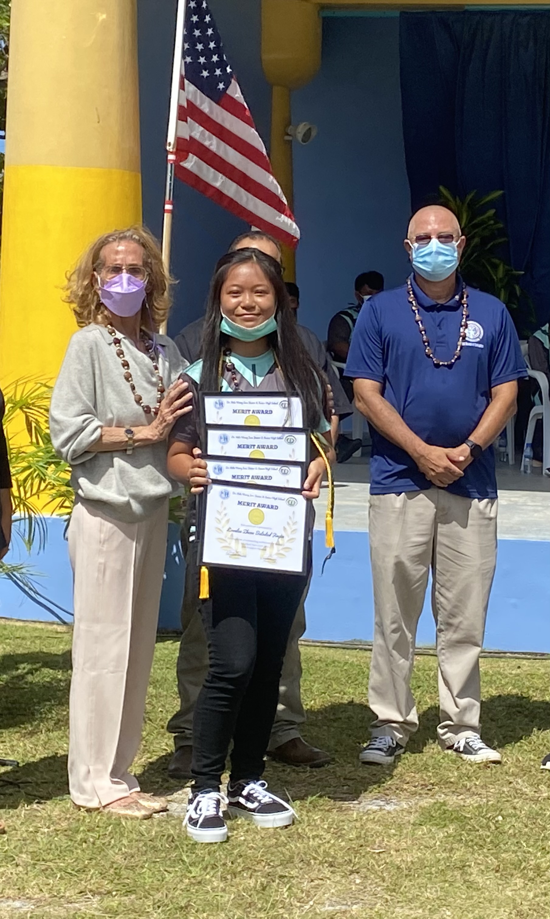 Junior high school salutatorian Lovelee Zhene Balidad receives the subject awards for Science, Social Studies, Leadership Corps and Career Exploration-Fine Arts.