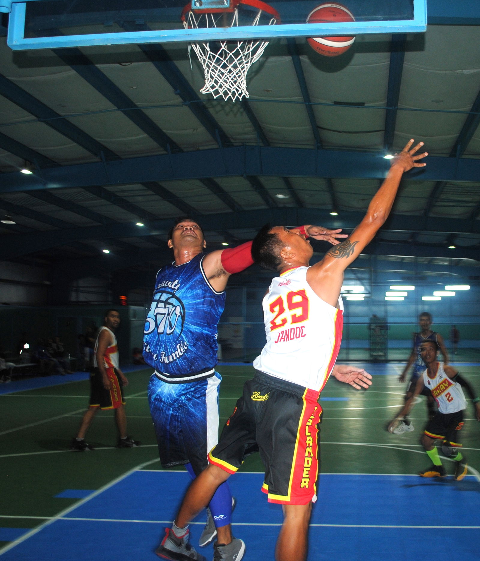 Lakay's Jandoc attempts the reverse layup during an open division game of the Saipan Centennial Lions Club Basketball League at the TSL Sports Complex.