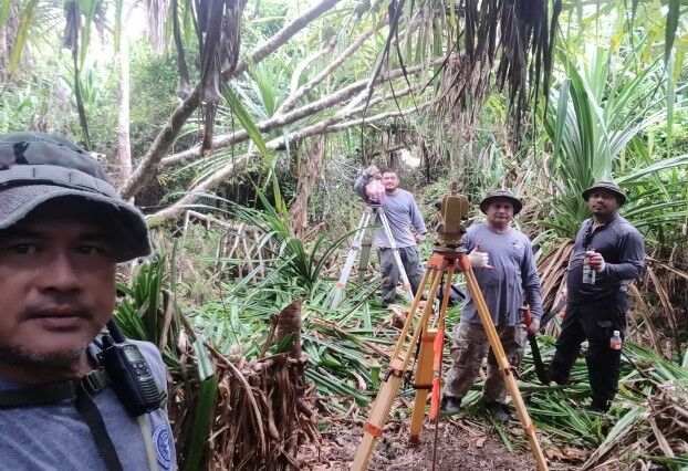 DPL surveyors in Fina’fa, Rota conducting retracement of right-of-way for road access.