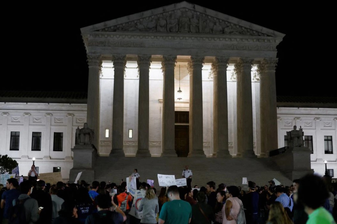Protestors react outside the U.S. Supreme Court to the leak of a draft majority opinion written by Justice Samuel Alito preparing for a majority of the court to overturn the landmark Roe v. Wade abortion rights decision in Washington, D.C., May 2, 2022.