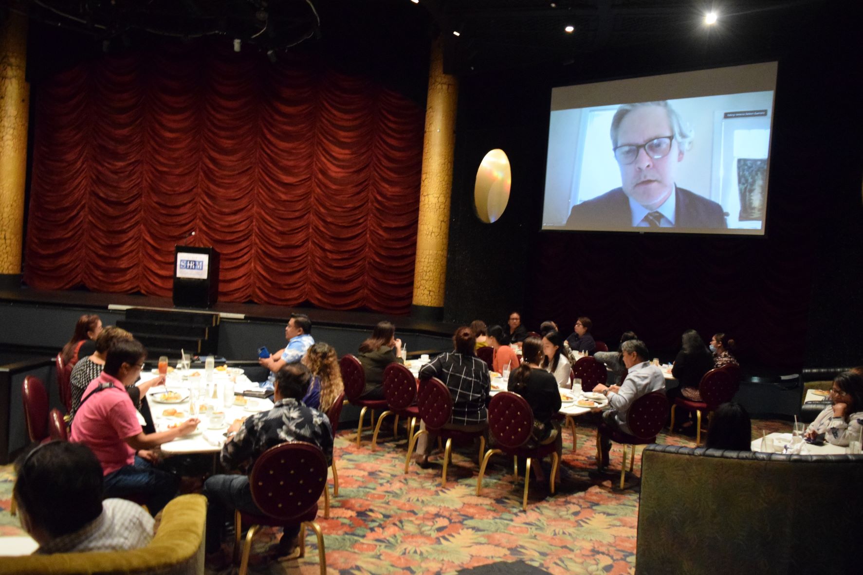Mike Graham of U.S. Citizenship and Immigration Services makes his presentation via video conference during a meeting of the Society for Human Resource Management- CNMI Chapter on Thursday in the Hyatt Regency Saipan Ballroom.