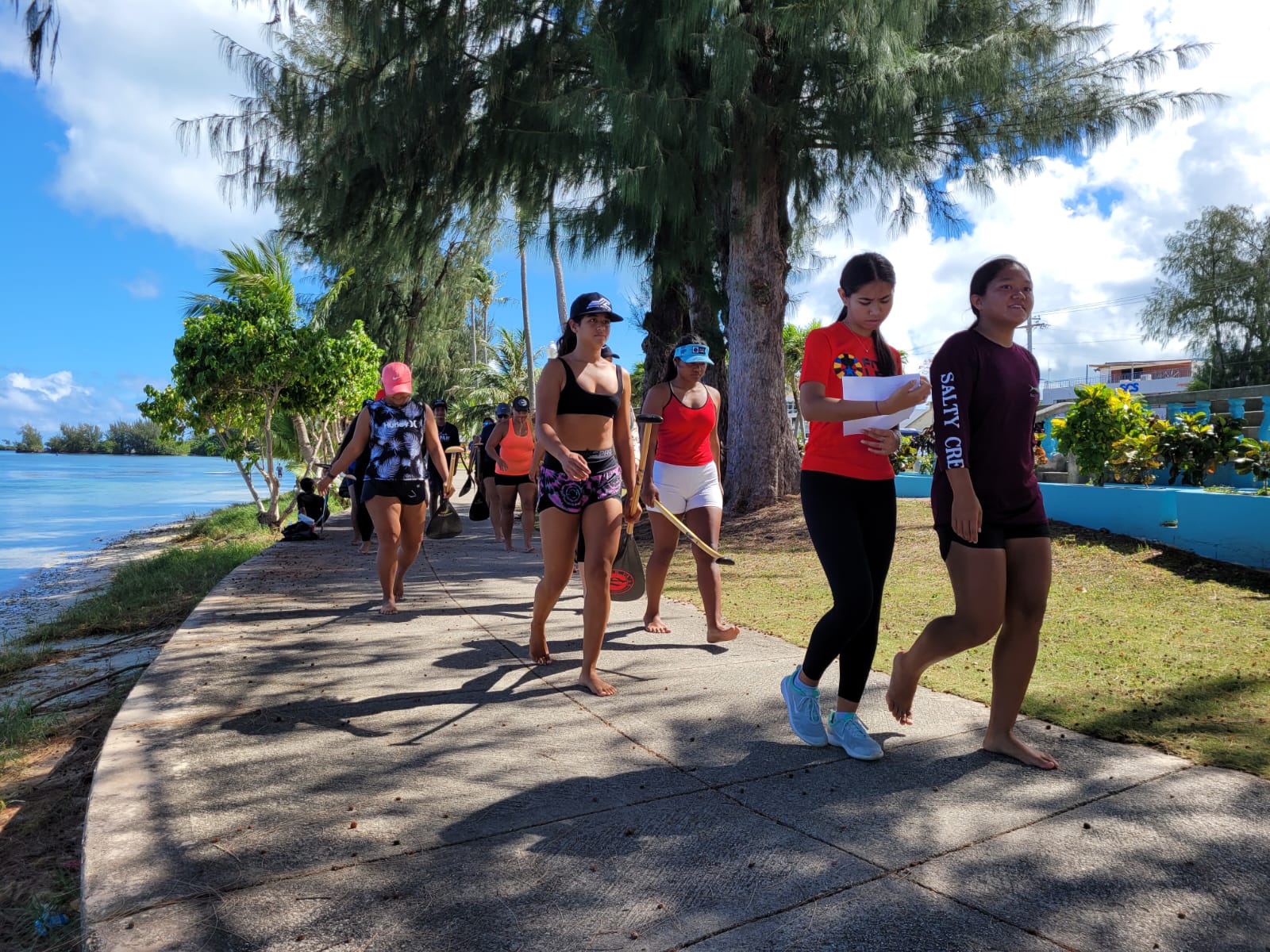 Prospective members of the CNMI women's team head to the canoes.