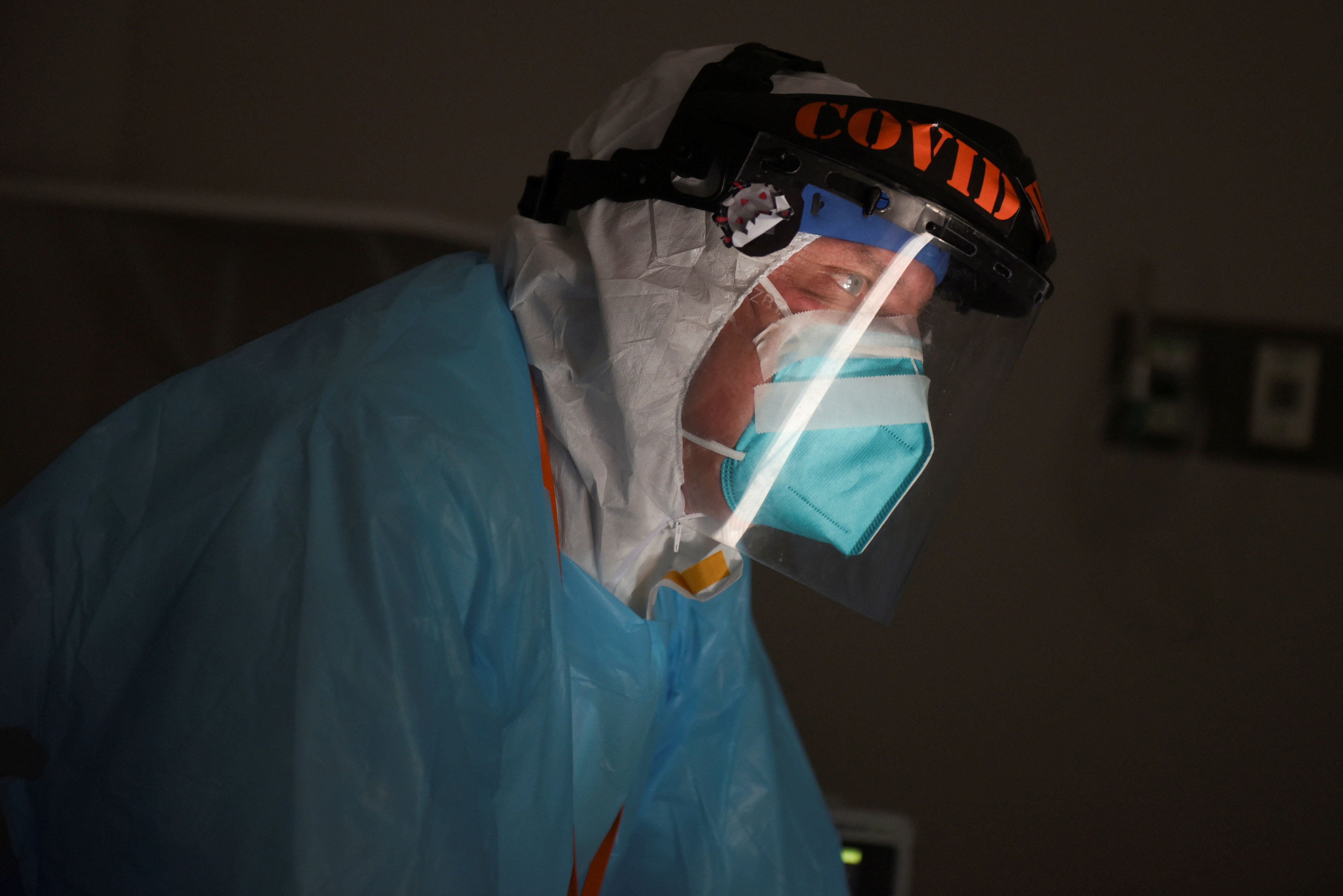 Dr. Joseph Varon checks on a patient as medical professionals treat people infected with the coronavirus disease at United Memorial Medical Center in Houston, Texas on Nov. 12, 2020.