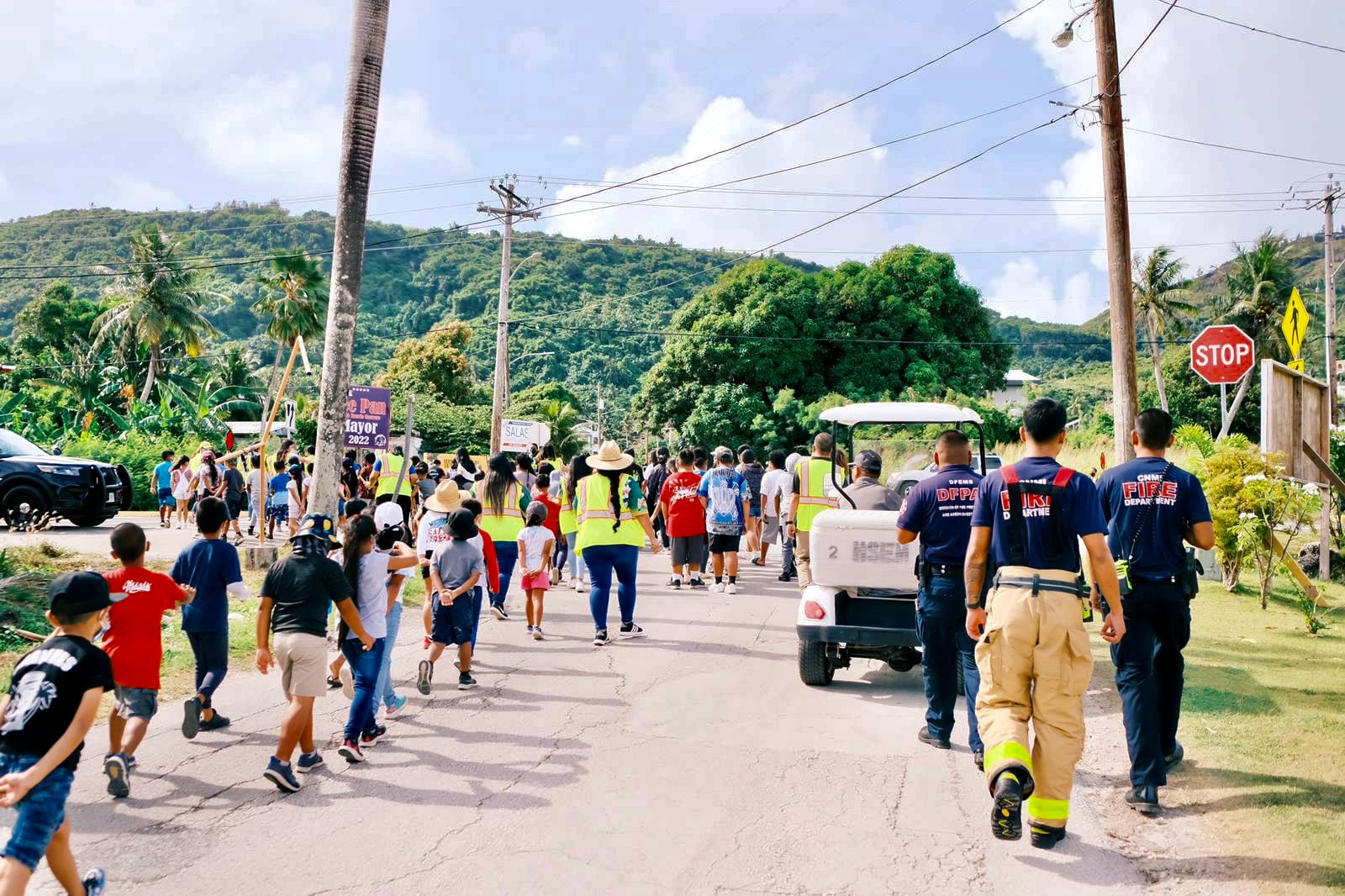 Department of Public Safety, fire department, CNMI Homeland Security and school personnel safely escort Gregorio T. Camacho Elementary School students to their evacuation site during a tsunami drill on Tuesday.