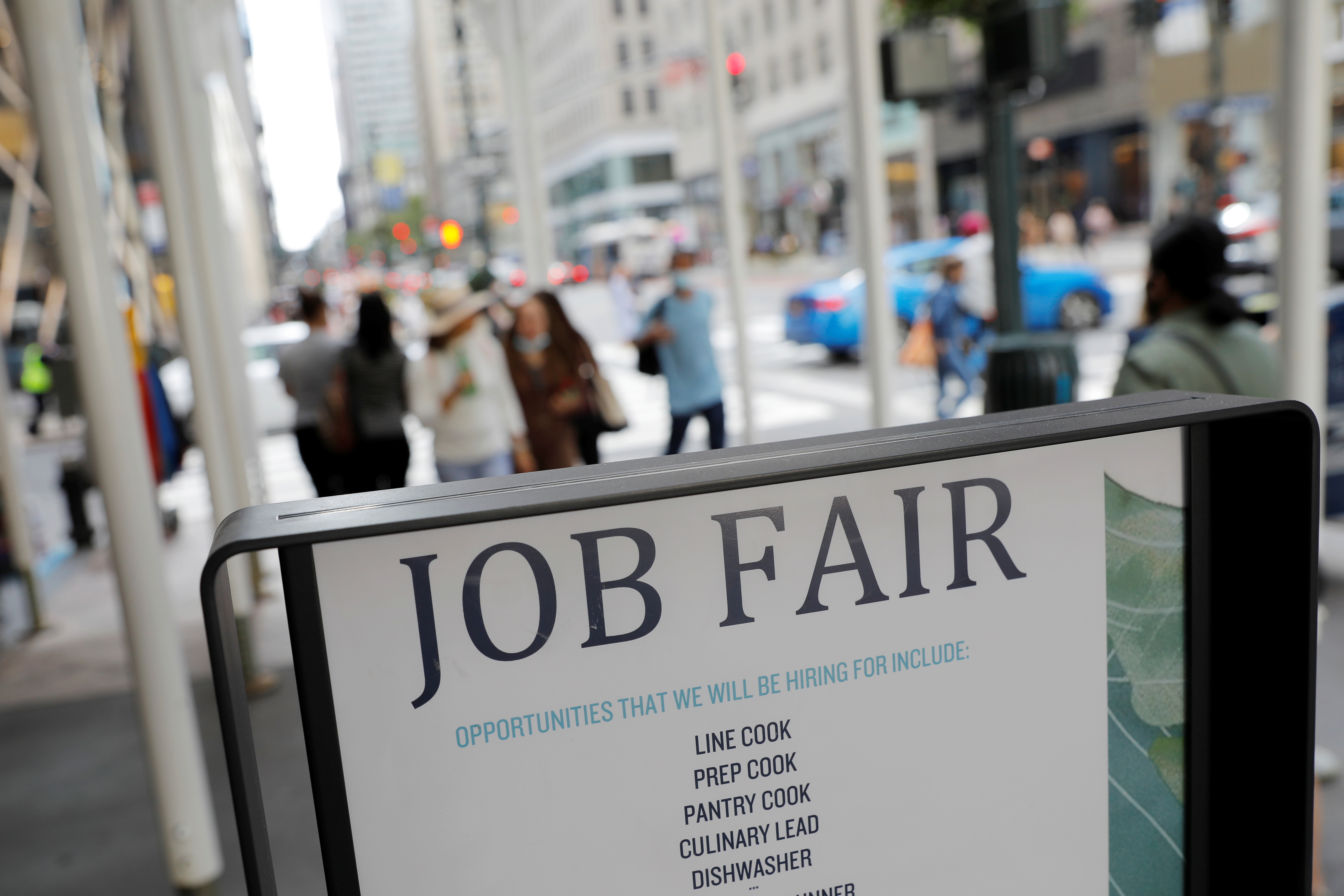 Signage for a job fair is seen on 5th Avenue after the release of the jobs report in Manhattan, New York City on Sept. 3, 2021.