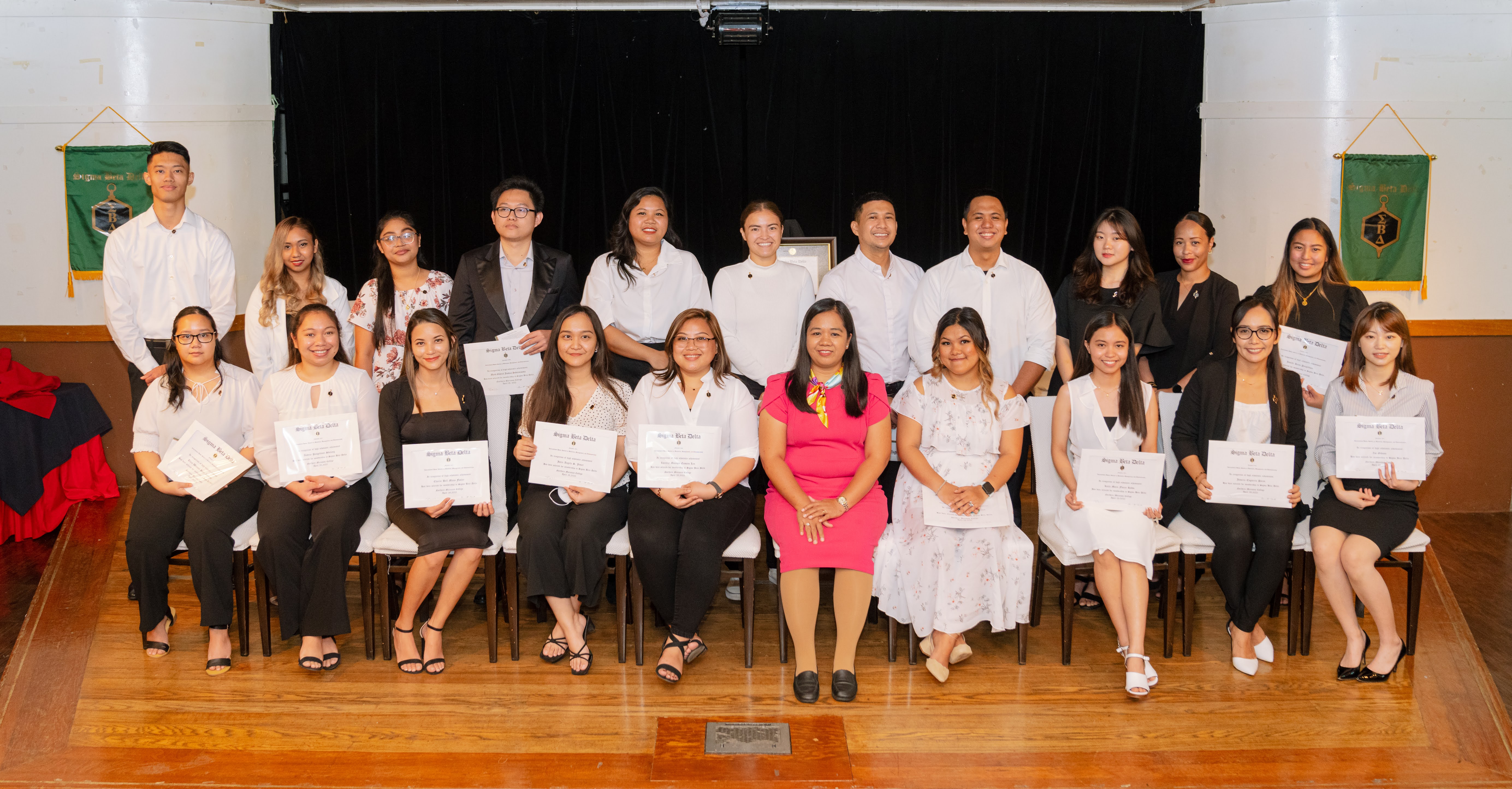 Newly inducted members of the Sigma Beta Delta Honor Society at Northern Marianas College pose for a photo during their induction ceremony. Joining them is Interim Dean for Academic Programs and Services Vilma Reyes.