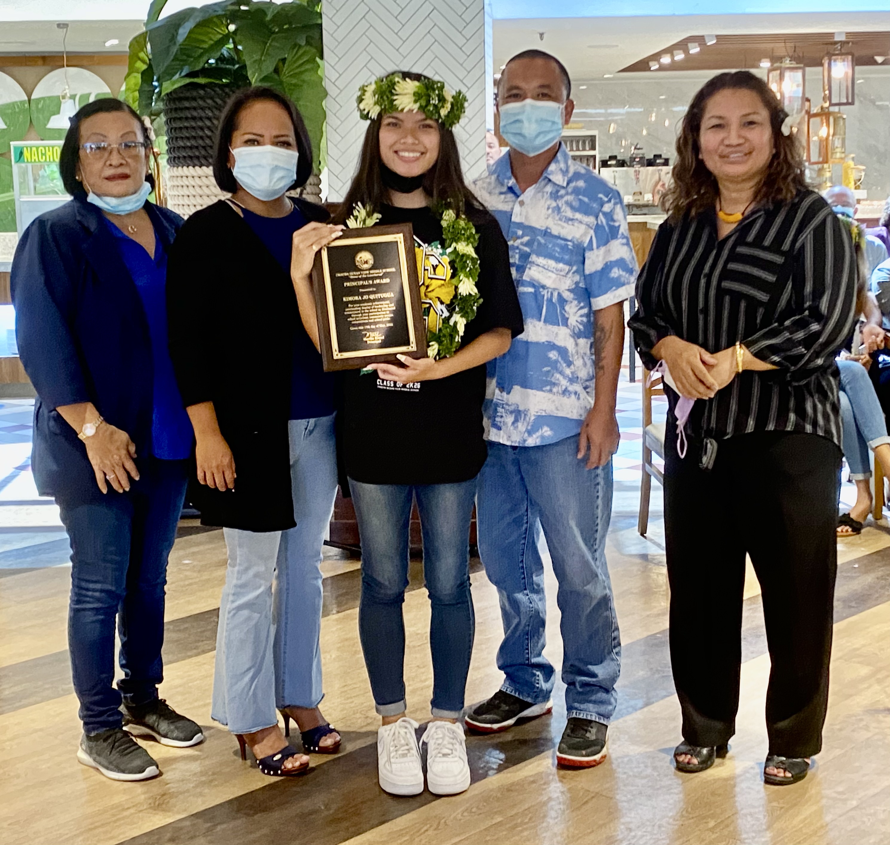 Chacha Principal’s Award recipient Kimora Jo Quitugua and her parents with Principal Martha Kintol, and the elementary schools’ principal representative, Dr. Ignacia Demapan of Kagman Elementary School.