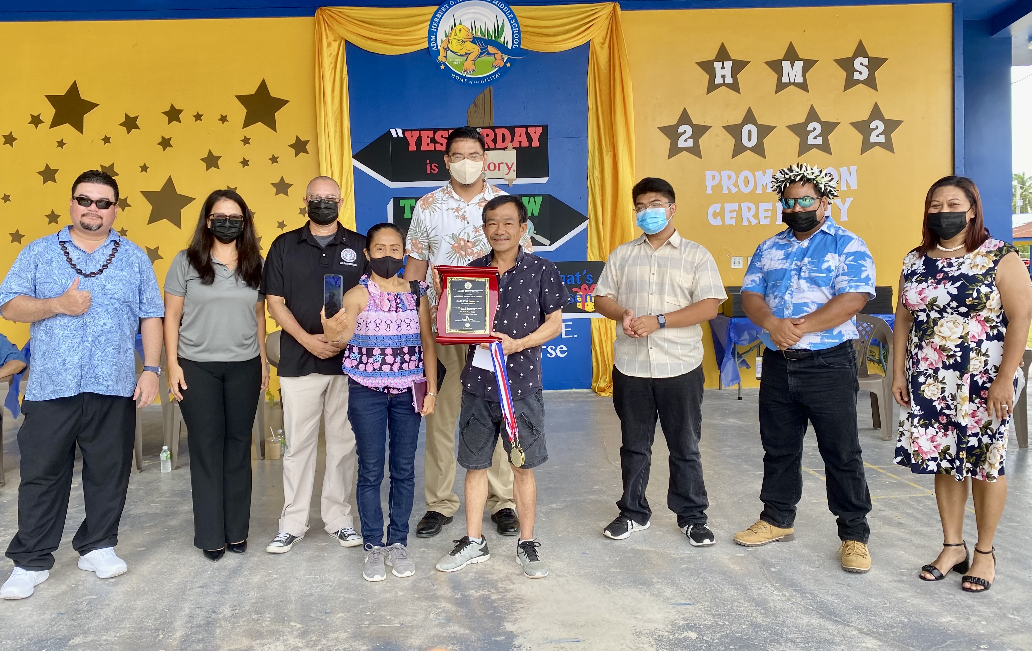 Samuel Costales, center, and Irene Costales, father and aunt, respectively, of Hopwood Middle School valedictorian and Board of Education Award recipient, Mark Ryan Ortizo Costales, receive the awards from BOE Chairman Gregory Pat Borja, BOE Vice Chairman Antonio L. Borja, Secretary/Treasurer Maisie B. Tenorio, and student representative Jed Sta. Theresa. Also in photo are Hopwood Principal Victorino Borja and Vice Principals Karen Manuel and Ben Seman.