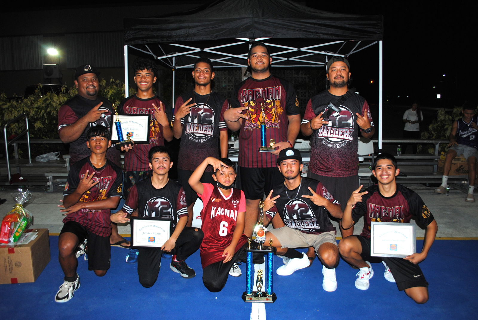 The K2 Ballers pose with the championship trophy.