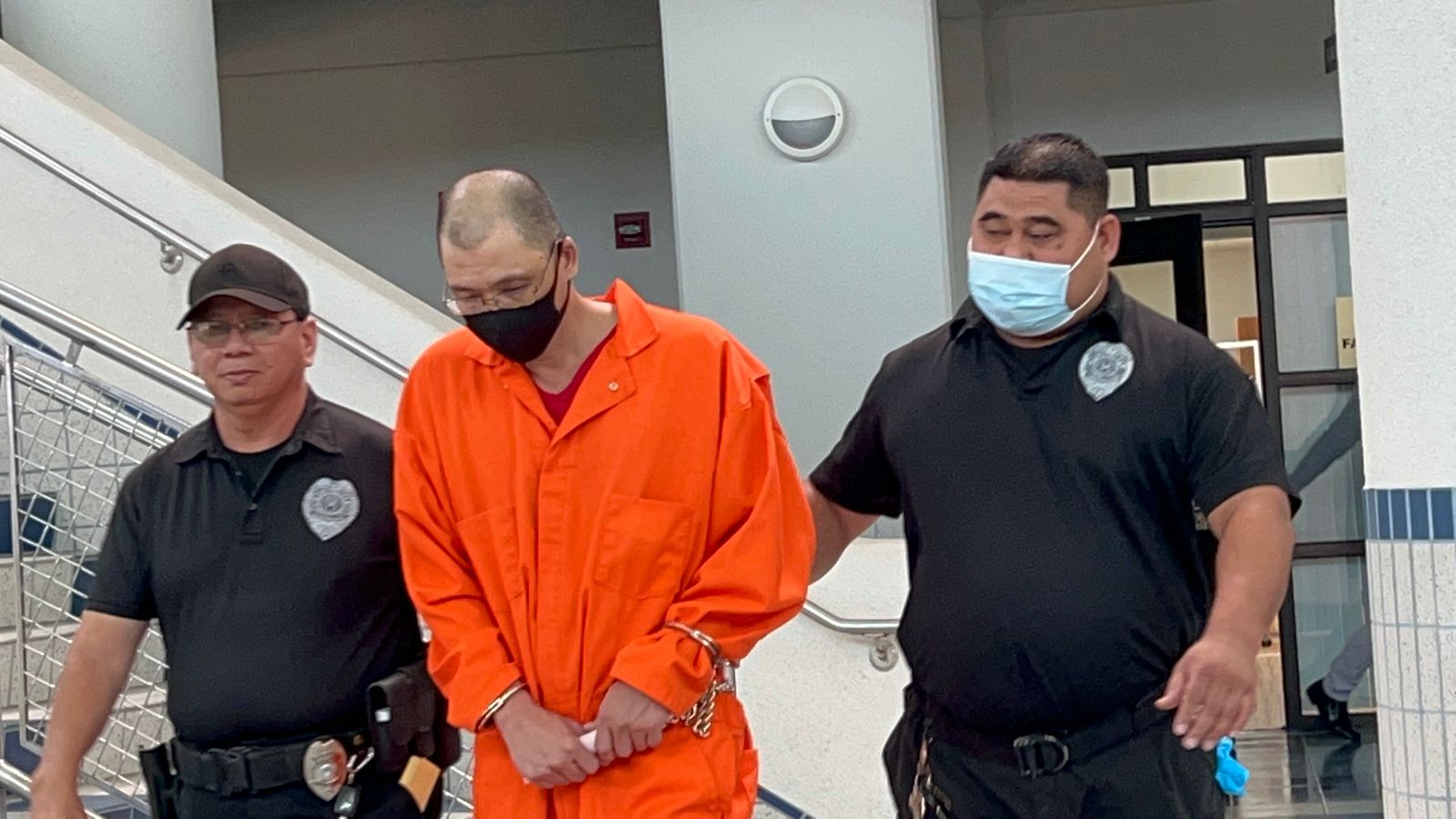 Rui Jun Huang is escorted by Corrections officers after a bail hearing on Thursday morning.