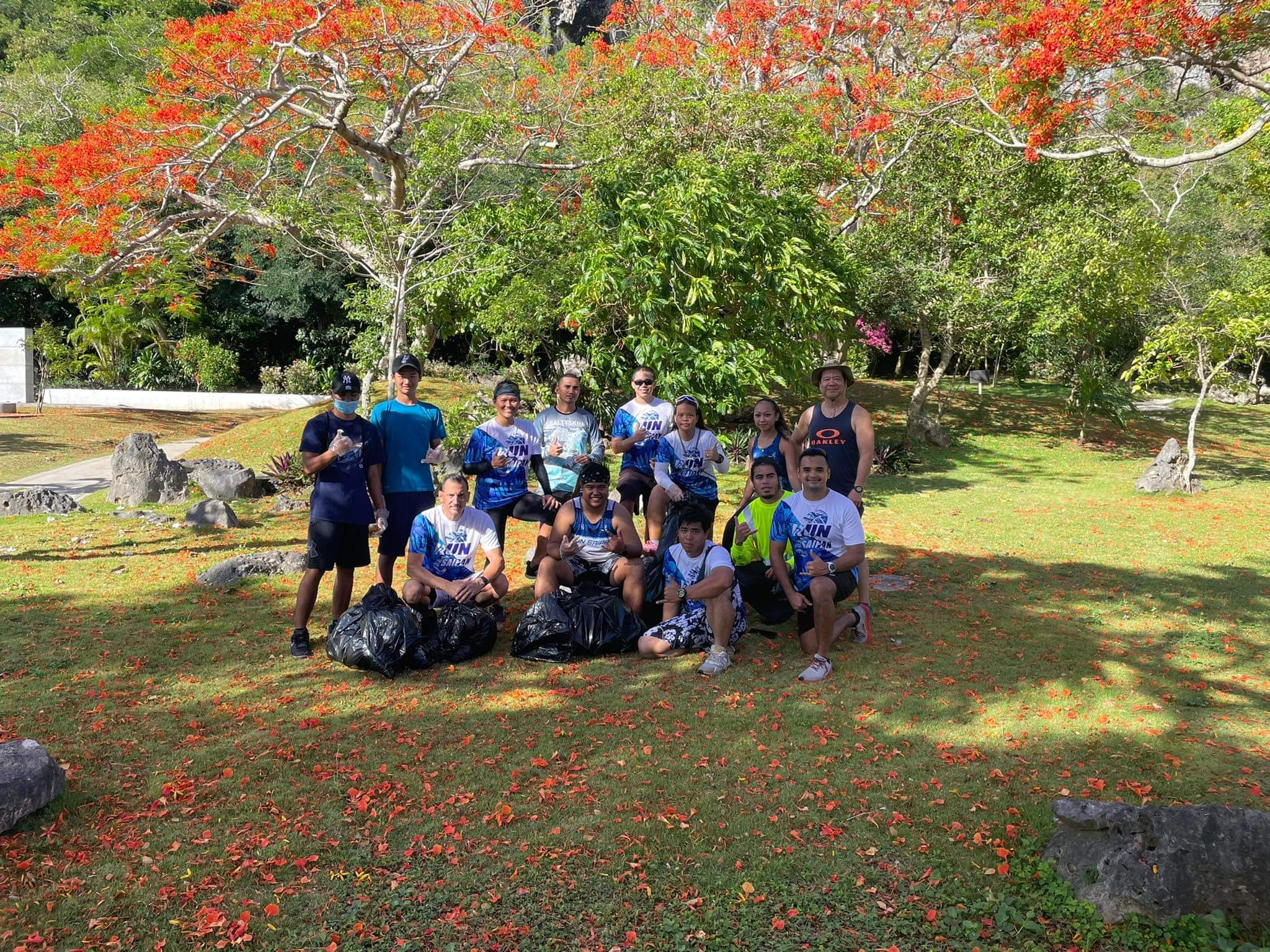 Run Saipan, Salty Skin Pacific, MVA and Northern Marianas Athletics members pose for a photo after collecting trash in Marpi on Saturday.