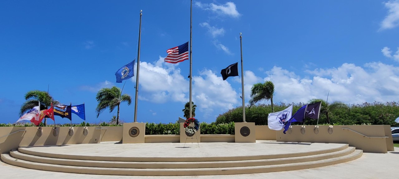 A ceremonial wreath lies at the foot of the U.S. flag at the CNMI Veterans Cemetery.