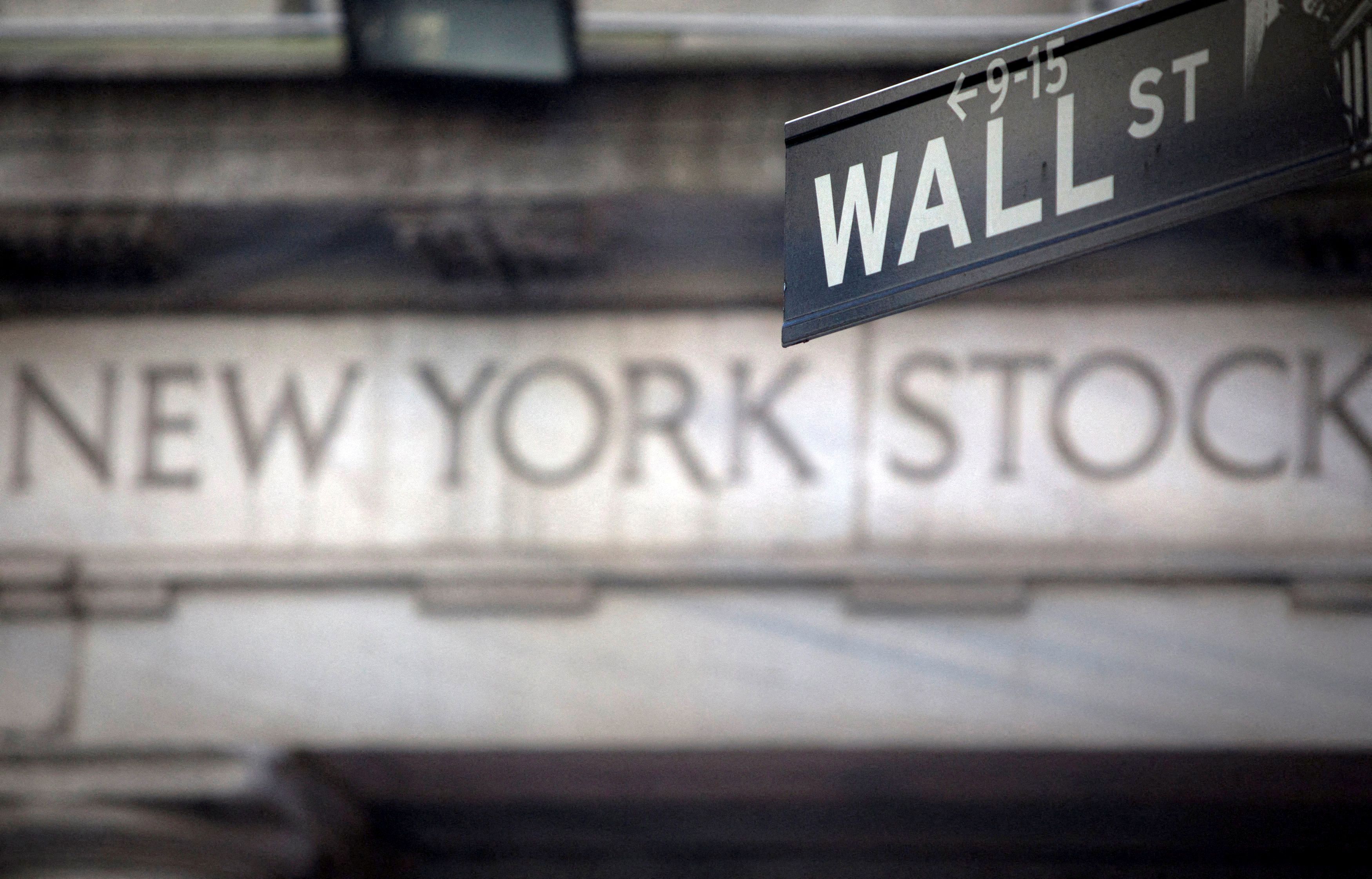A Wall Street sign is pictured outside the New York Stock Exchange in New York, Oct. 28, 2013.