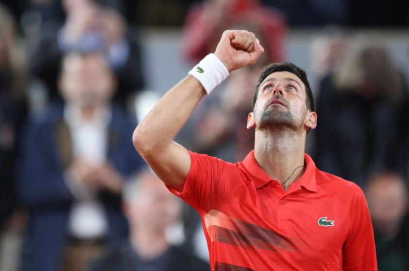 Serbia's Novak Djokovic celebrates after winning his first round French Open  match against Japan's Yoshihito Nishioka at Roland Garros, Paris, France on May 23, 2022.