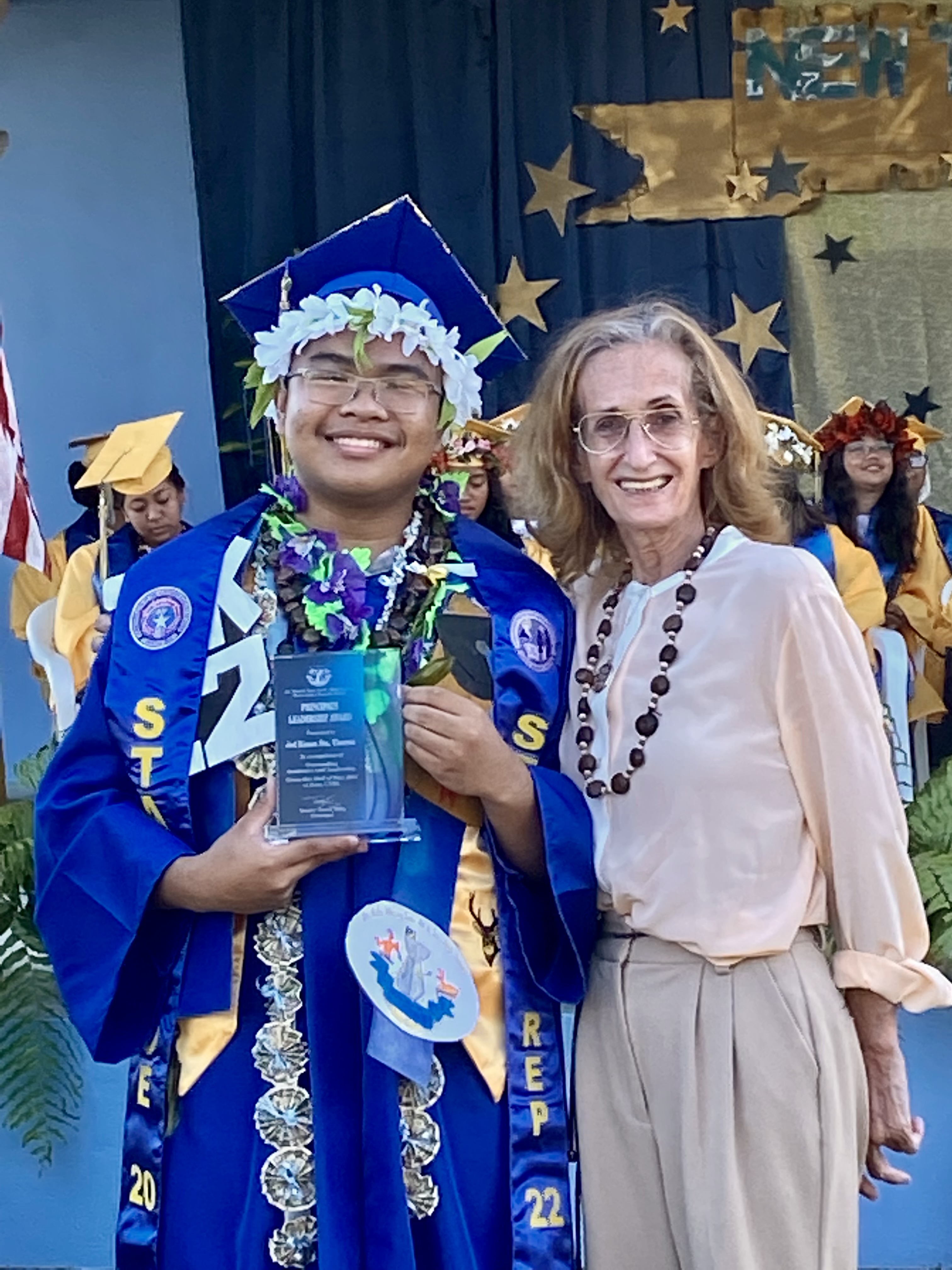 Board of Education Student Representative and graduating senior Jed Sta. Theresa receives the Principal’s Leadership Award from School Principal D. Tanya King.
