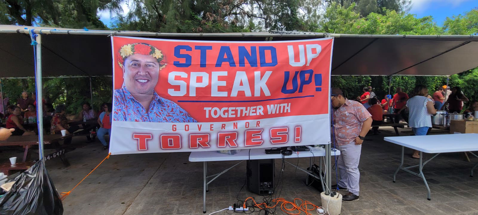 Supporters of Gov. Ralph DLG Torres gather at a canopy outside the legislative building on Capital Hill, Friday, May 13, as the Senate holds the first day of its impeachment hearing.