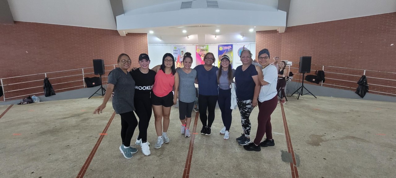 CHCC CEO Esther Muna, center, poses for a photo with CHCC staff.