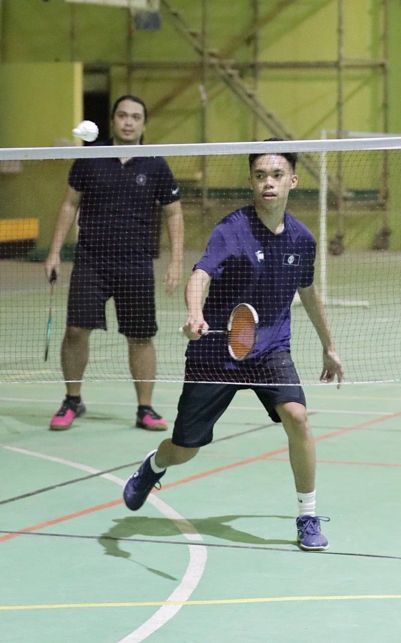 The NMI’s Leonard Manuel makes a return near the net, while teammate Daniel Macario looks on during a training match against Andreau Galvez and Jordan Pangilinan at the Gilbert C. Ada Gymnasium early this month.