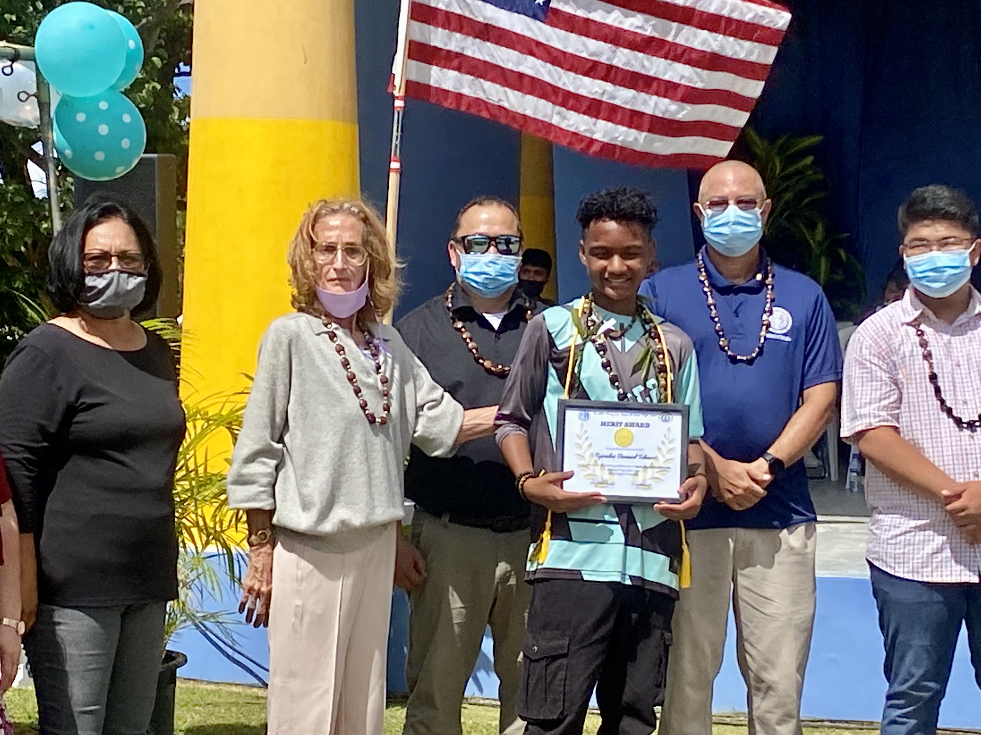 Newly promoted  Ngiraibai Bernard Takawo receives the subject award for Career Exploration-Fine Arts.