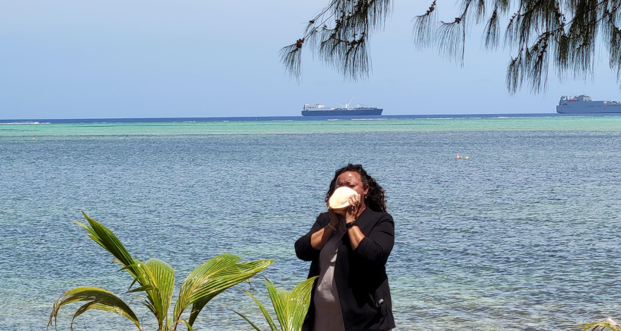 Rep. Leila Haveia F. Staffler blows a “kulu” or conch shell.