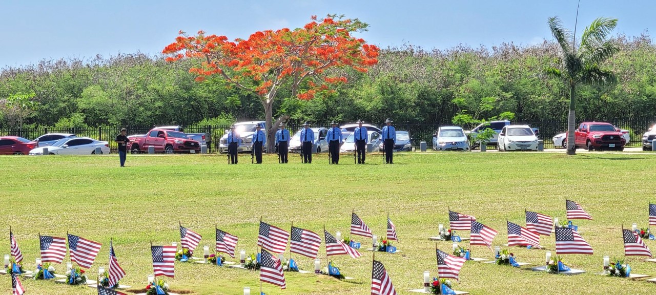 Department of Public Safety officers prepare for the 21-gun salute.