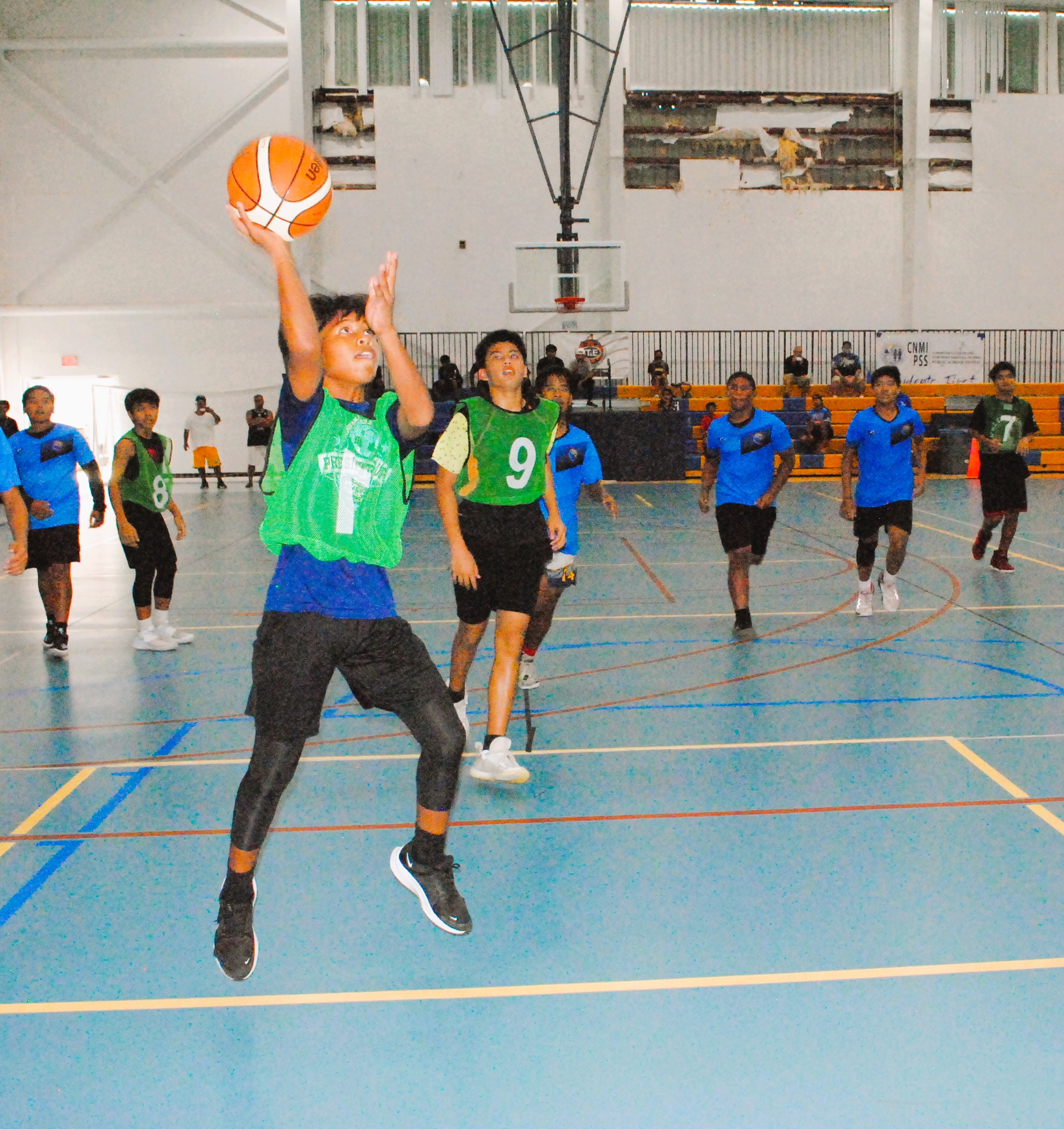 Hopwood 1's Tyler Omelau extends for the finish during a game of the IT&E Interscholastic Boys Middle School Basketball League at the MHS gym.