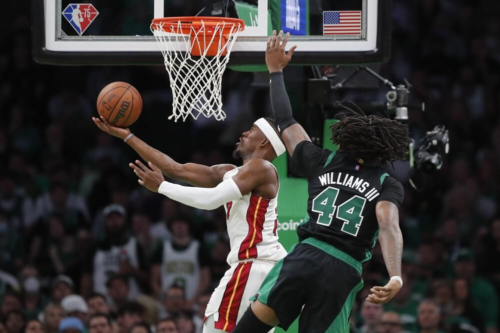 Miami Heat's Jimmy Butler shoots against Boston Celtics' Robert Williams III (44) during the second half of Game 6 of the NBA basketball playoffs Eastern Conference finals Friday, May 27, 2022, in Boston.