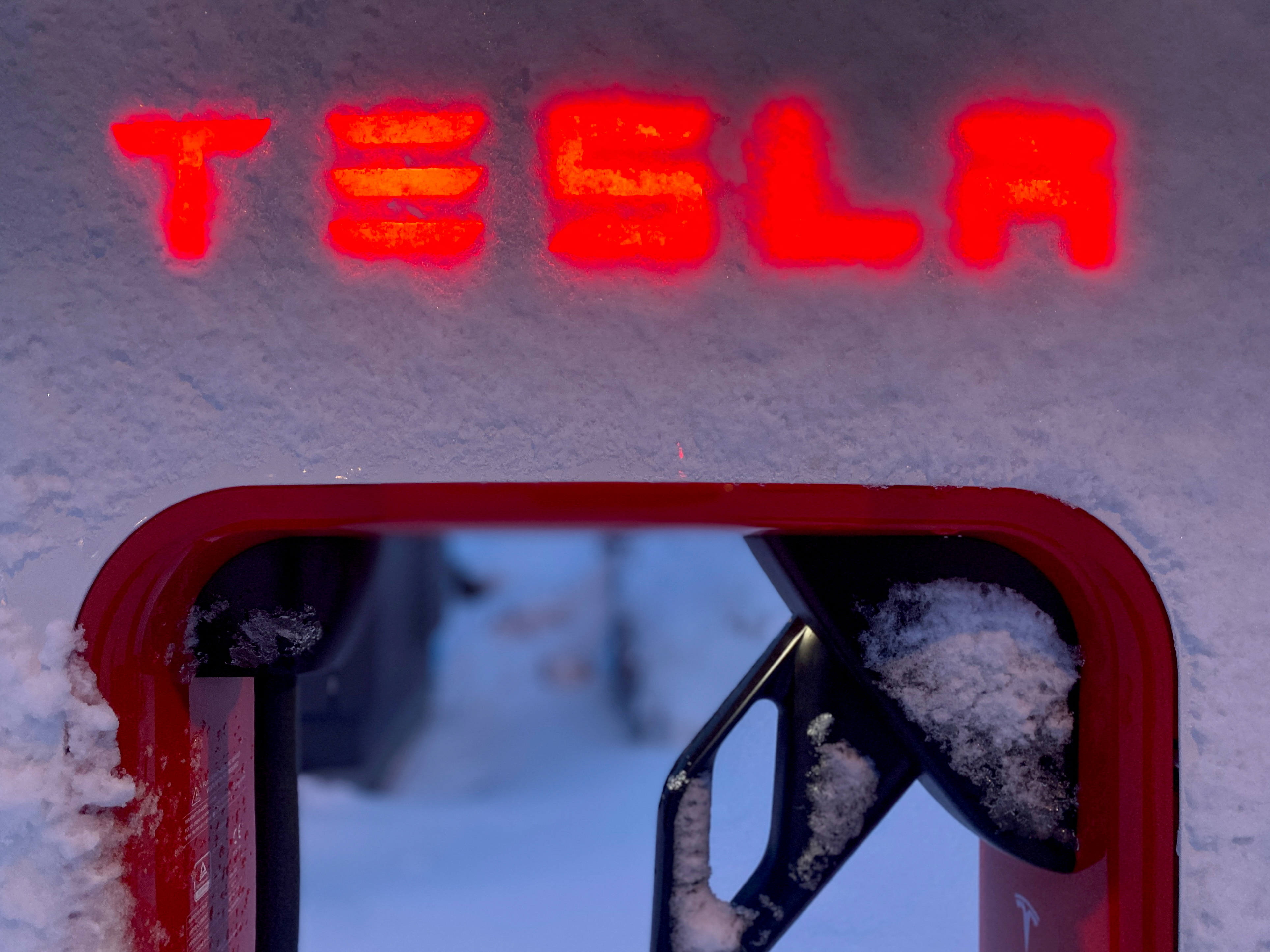 A Tesla electric vehicle charger is seen during the winter in Hofn, Iceland, Feb. 16, 2022.
