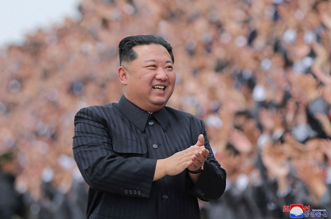 North Korean leader Kim Jong Un applauds during a photo session with students and young workers in Pyongyang, North Korea, in this undated photo released by North Korea's Korean Central News Agency on May 1, 2022.