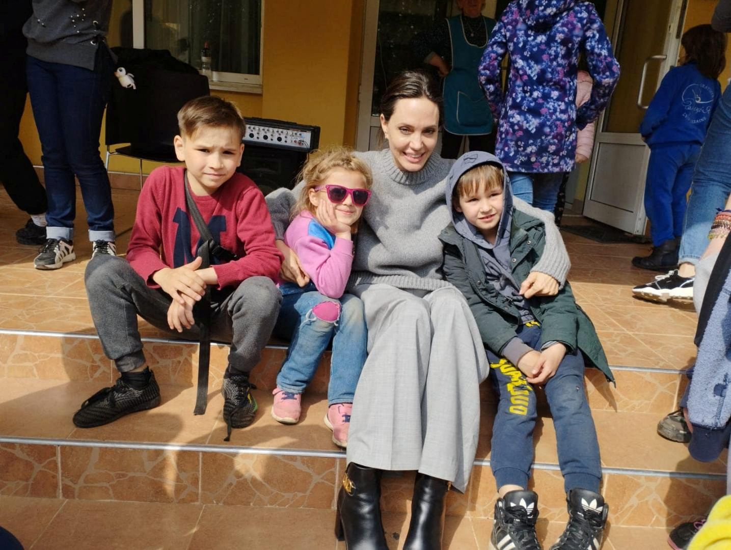Angelina Jolie poses for a picture with children, as Russia's attack on Ukraine continues, in Lviv, Ukraine on April 30, 2022.