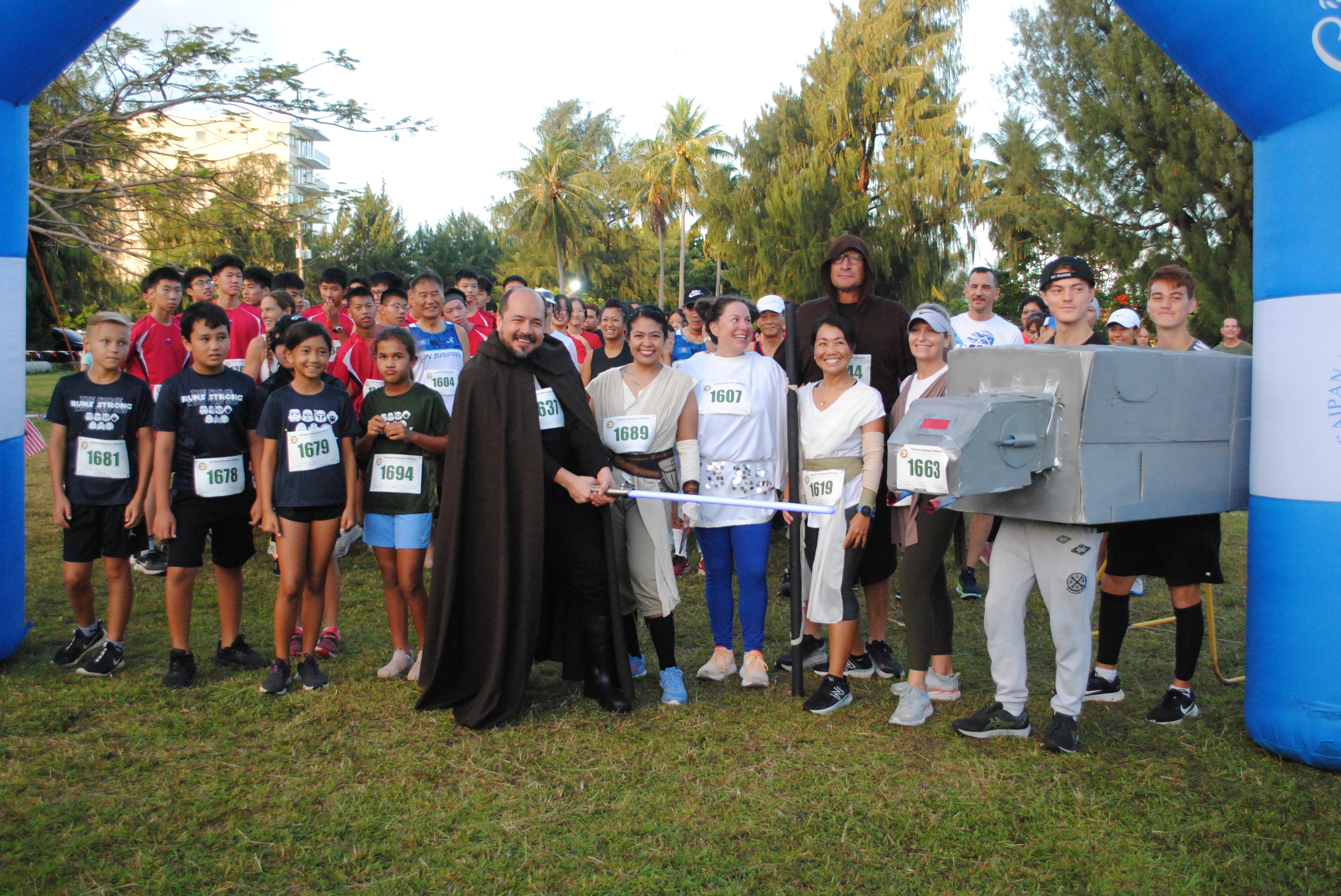 The participants, some of whom in Star Wars costumes, pose for a photo before the start of the 2nd CNMI Star Wars Day Run on Saturday morning at American Memorial Park.