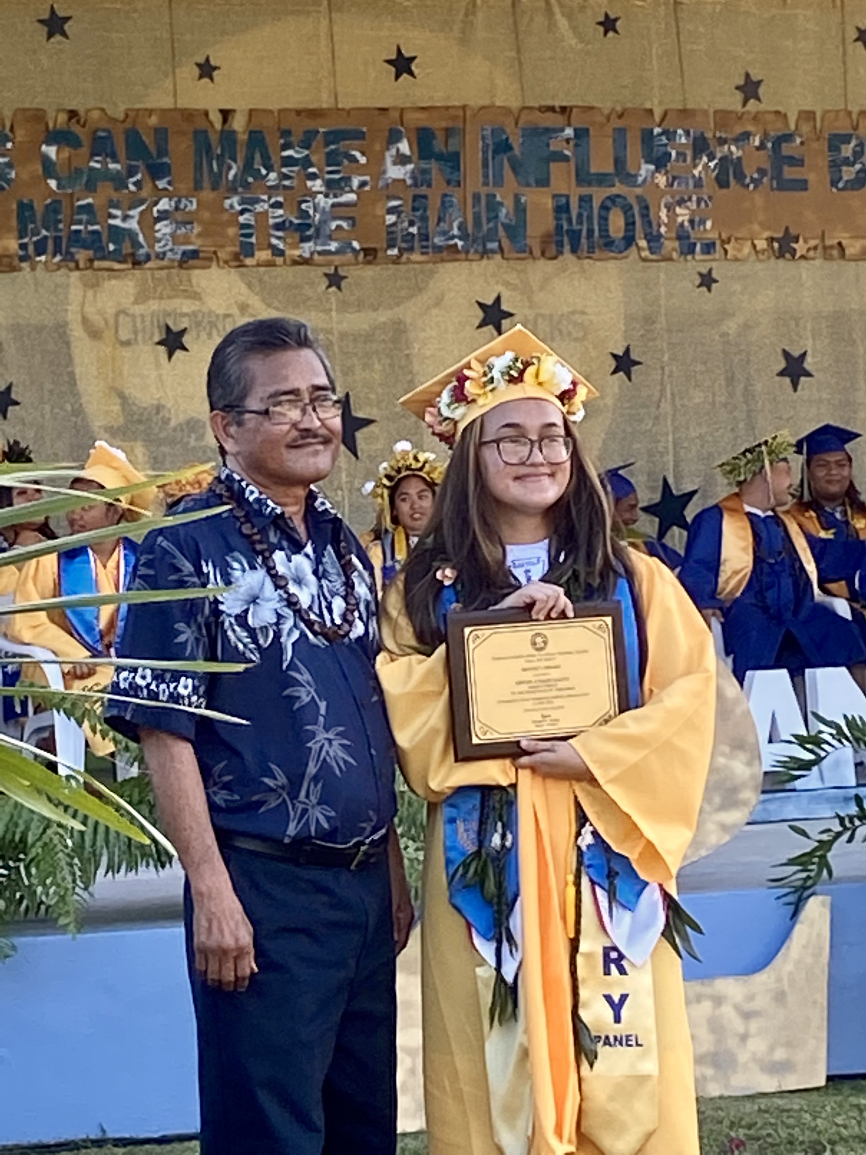 High school valedictorian Cevon Atalig Calvo receives the Mayor’s Award from Rota Mayor Efraim Atalig.