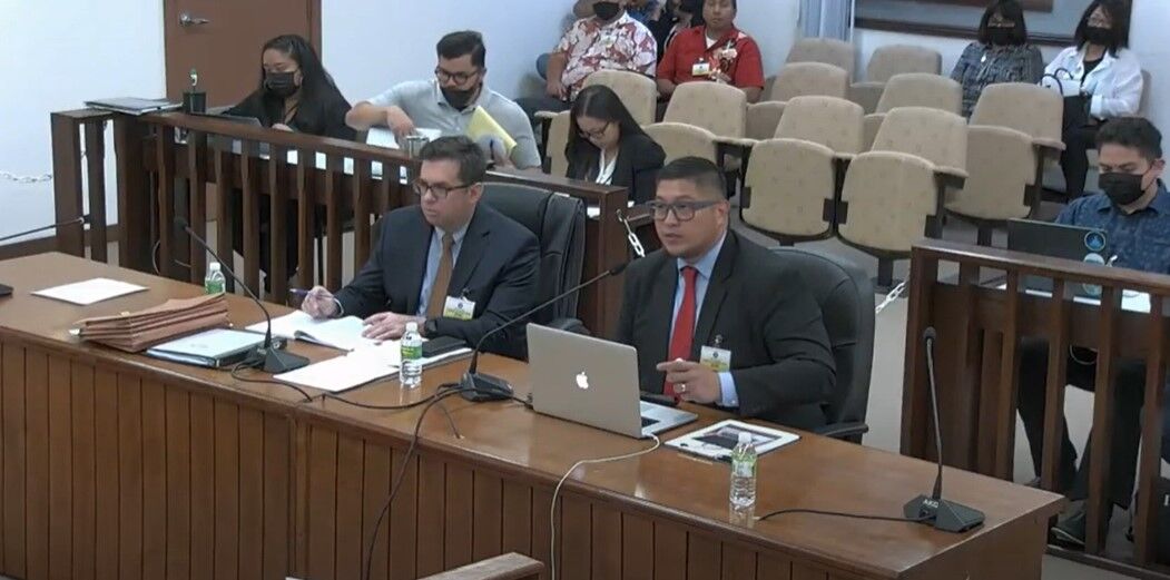 The governor's lawyer, Anthony Aguon, right foreground, and legal counsel  Gilbert J. Birnbrich, left, appear before the Senate during the impeachment hearing Monday.