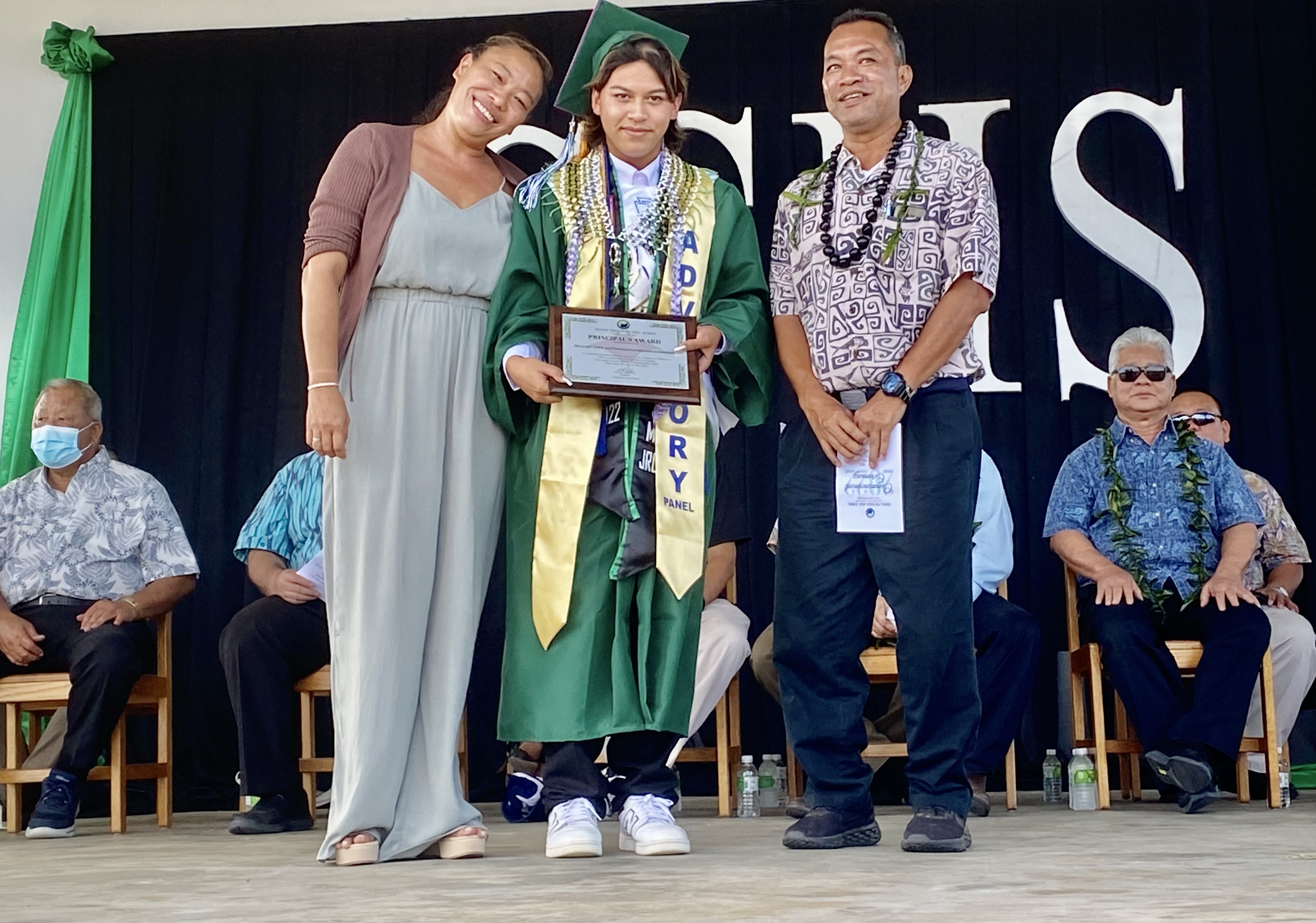 SSHS Principal Vince Dela Cruz and Vice Principal Arisa Sakai Peters present the Principal’s Award to Fran’ko Antwan Pangelinan Deleon Guerrero.