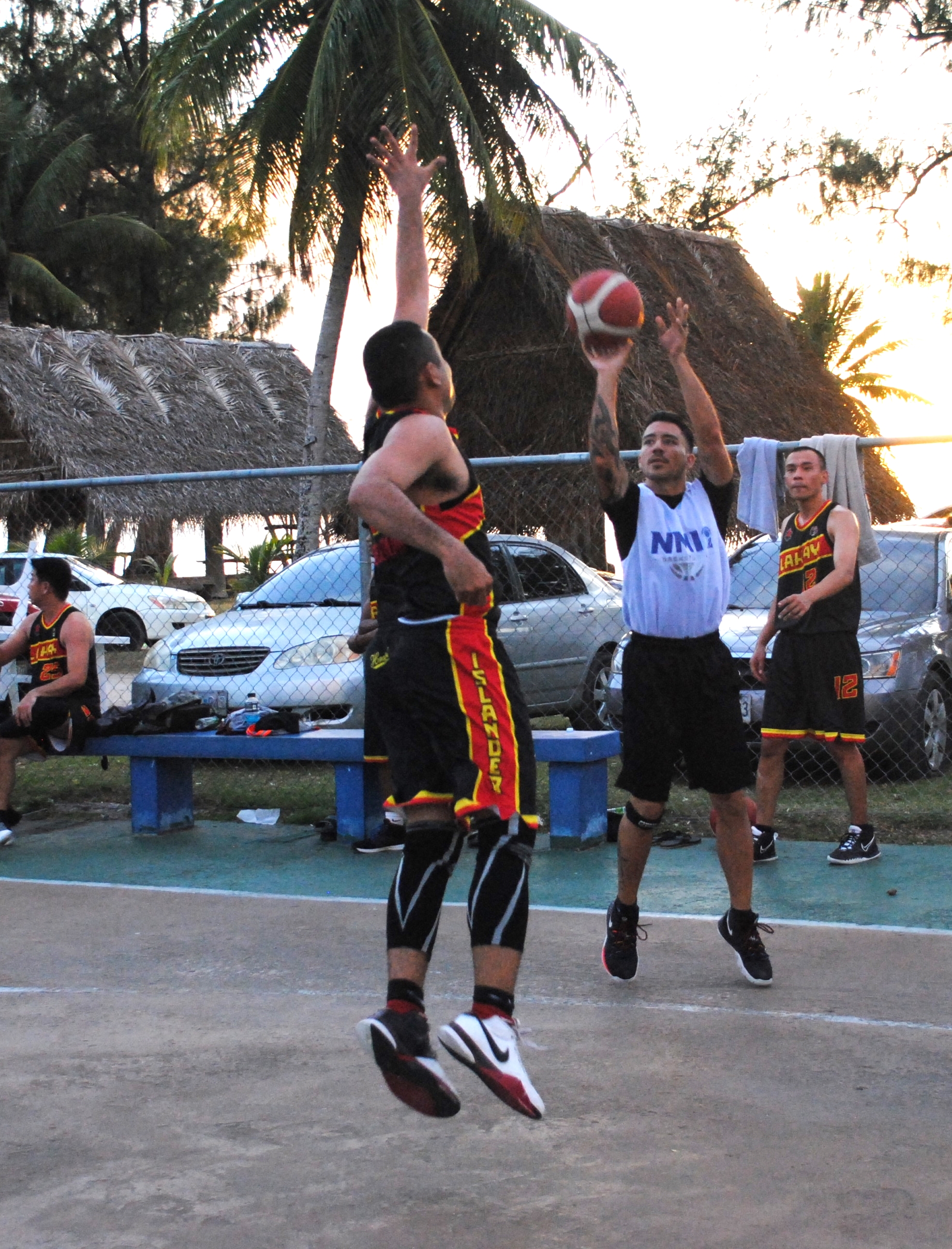 Team Marianas' Brennan takes the corner triple.