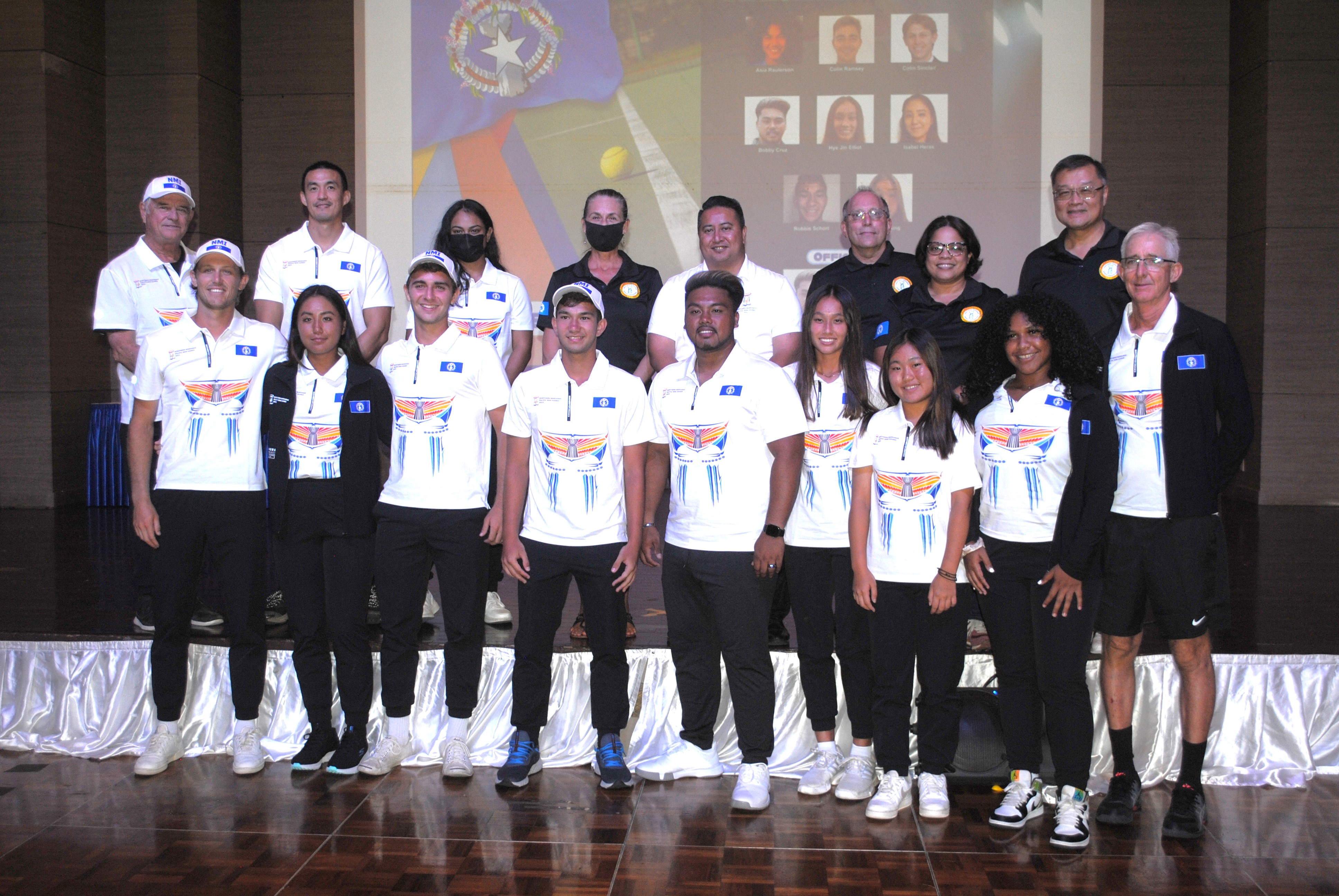 The members of the NMI men and women tennis teams in the Pacific Mini Games pose for a photo with Gov. Ralph DLG Torres and the Northern Marianas Sports Association board members during the Team NMI presentation in the Royal Taga Hall of Saipan World Resort on Tuesday.