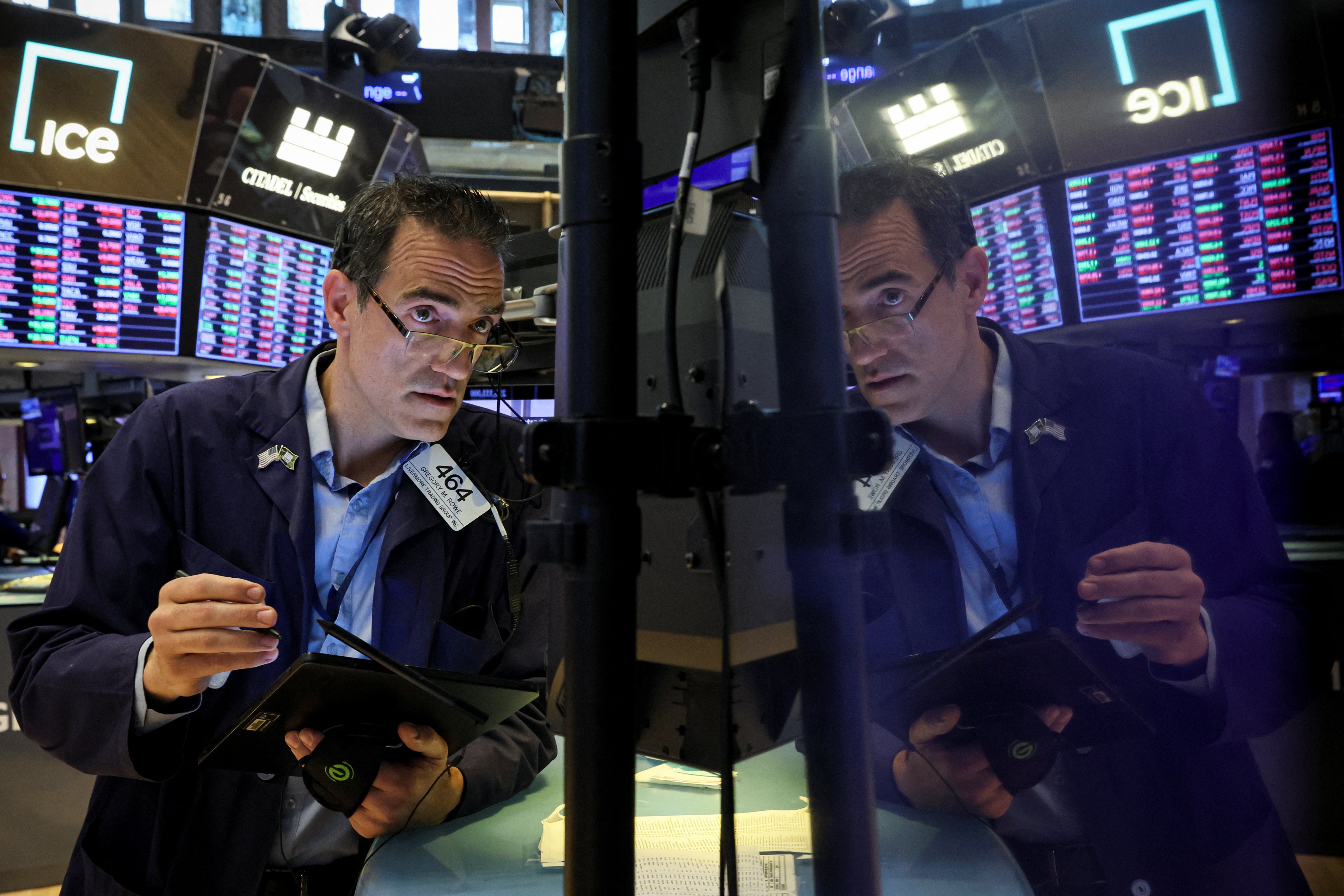 A trader works on the floor of the New York Stock Exchange in New York City, June 7, 2022.