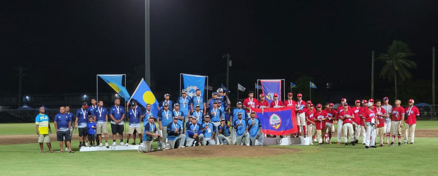 The gold medalist, Team NMI, center, with silver medalist Guam, right, and bronze medalist Palau  on the podium following the  2022 Pacific Mini Games baseball finals at the Francisco “Tan Ko” M. Palacios Baseball Field on Friday evening.