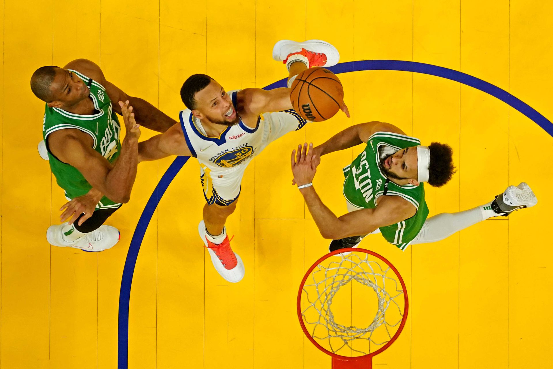 Golden State Warriors guard Stephen Curry (30) goes for a rebound against Boston Celtics center Al Horford (42) and guard Derrick White (9) during game two of the 2022 NBA Finals at Chase Center in San Francisco, California on June 5, 2022.