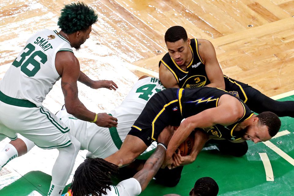 Golden State Warriors guard Stephen Curry (30) goes for the ball against Boston Celtics center Al Horford (42) during the fourth quarter in game three of the 2022 NBA Finals at TD Garden in Boston, Massachusetts on June 8, 2022.