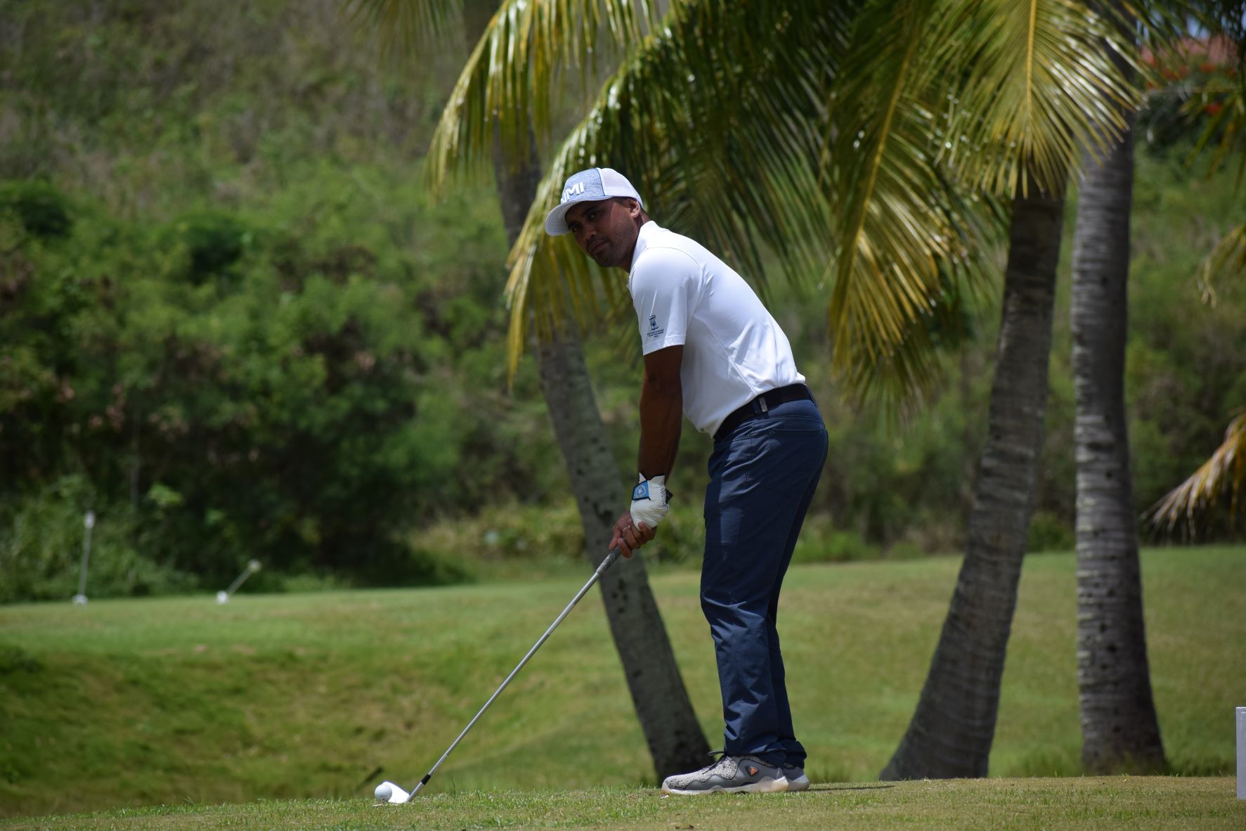 The NMI's Franco Santos prepares to tee off on Hole No. 3.