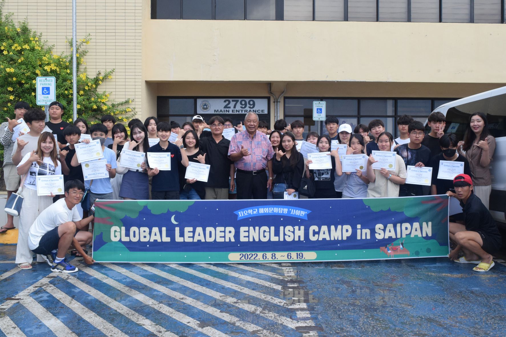 Saipan Mayor David M. Apatang, center, joins students of Global Oriented School and their principal, Kwang Yul Seo, who received their certificates of appreciation from the municipal government on Friday.