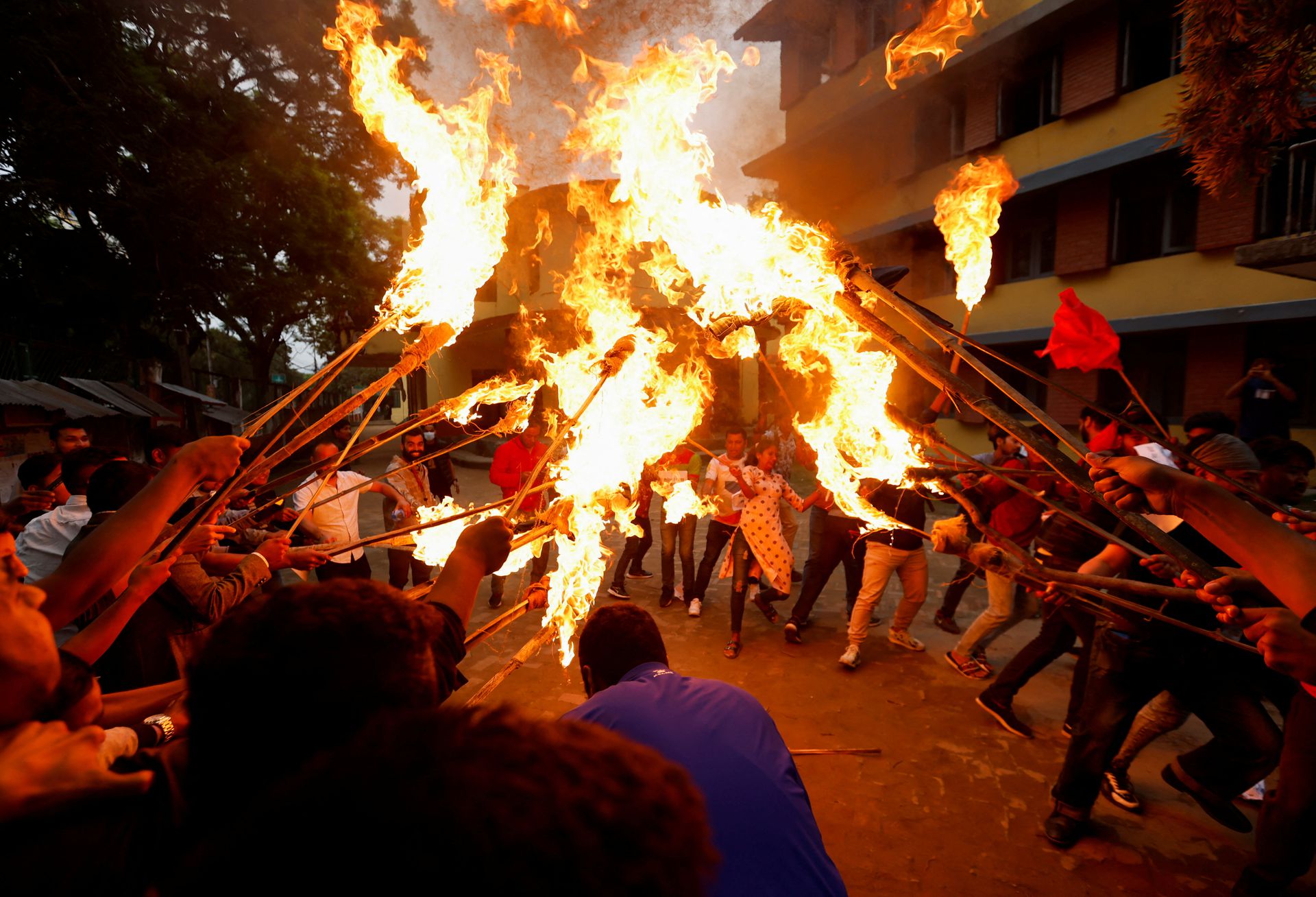 Students affiliated with the main opposition party hold a torch rally during the protest against the rise in fuel prices in Kathmandu, Nepal on June 20, 2022.