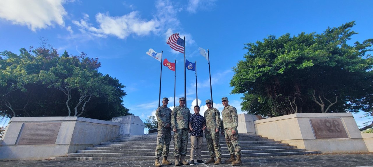 Reyel Quezon, center, poses for a photo with members of the Guam Army National Guard.